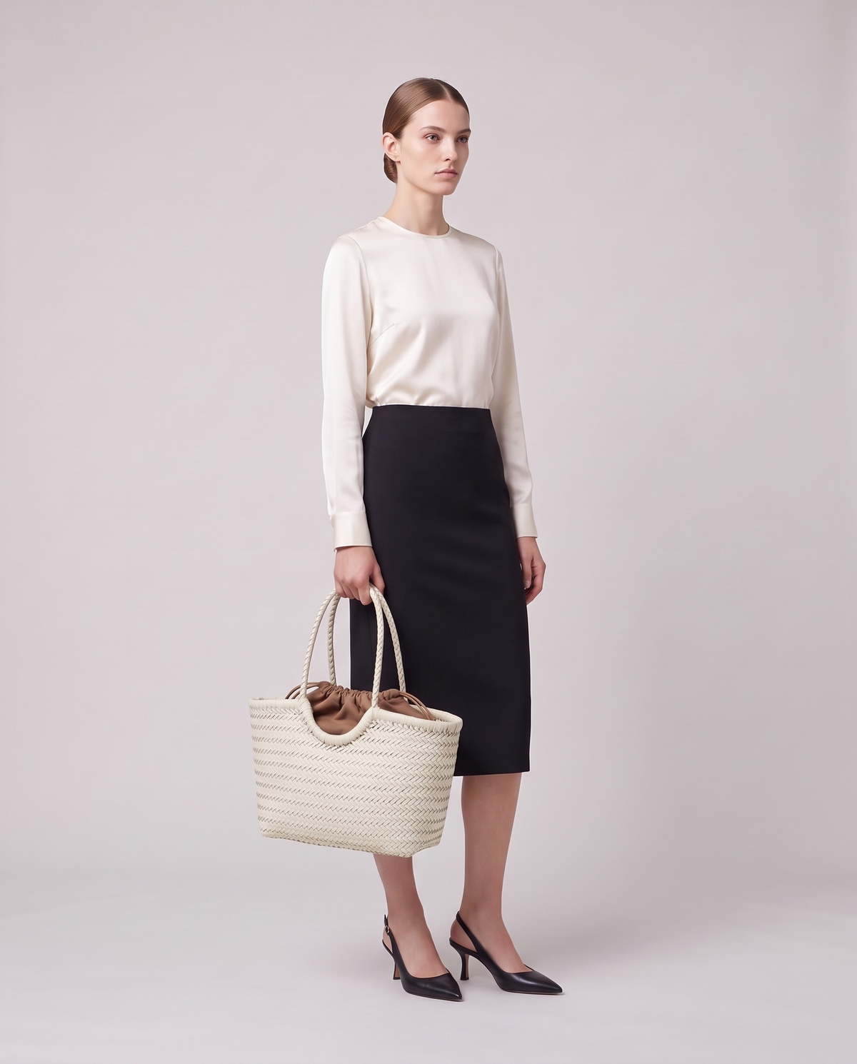 Model holding the Valentina Noto Large bag in White, full length