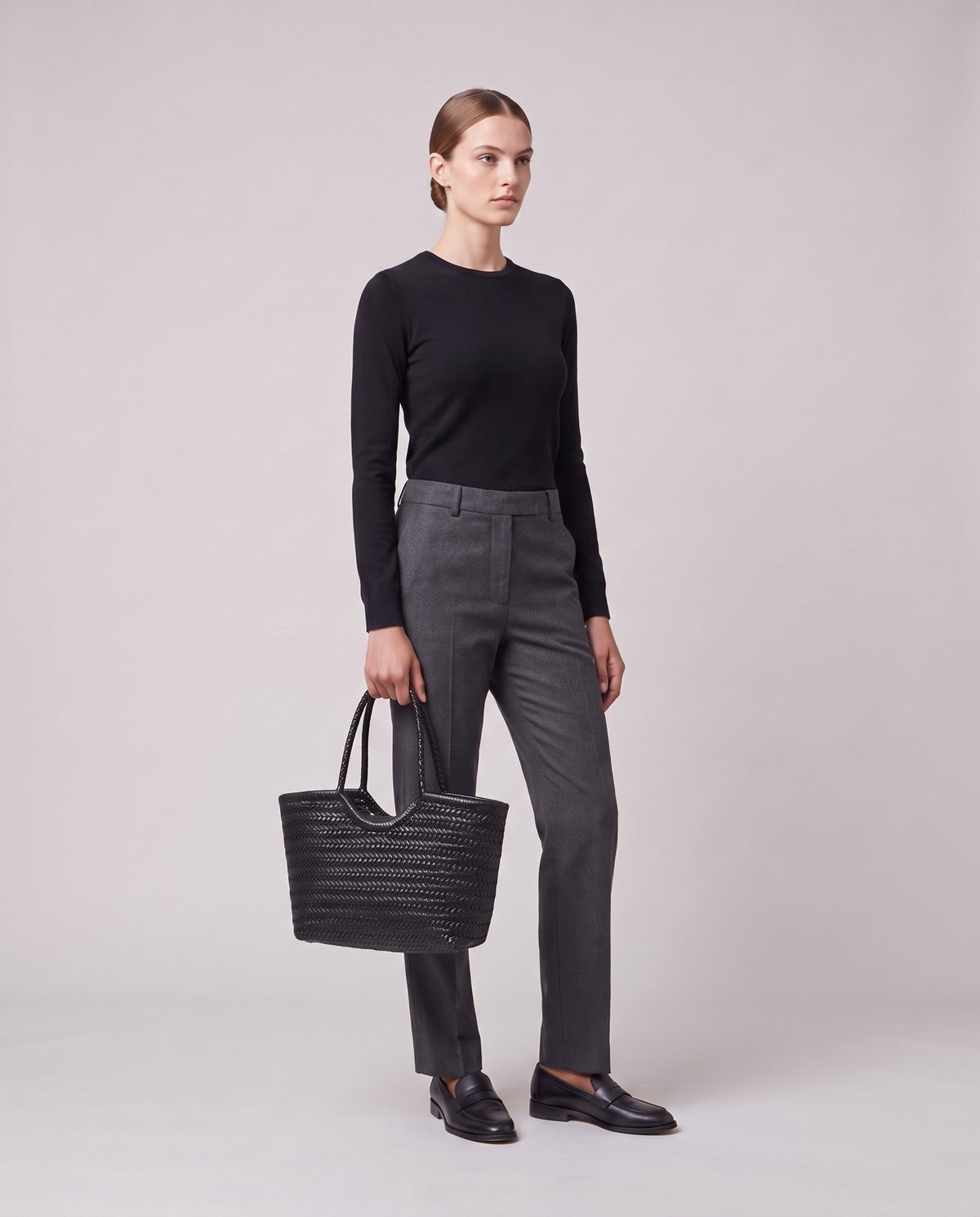 Model holding the Valentina Noto Small bag in Black, full length