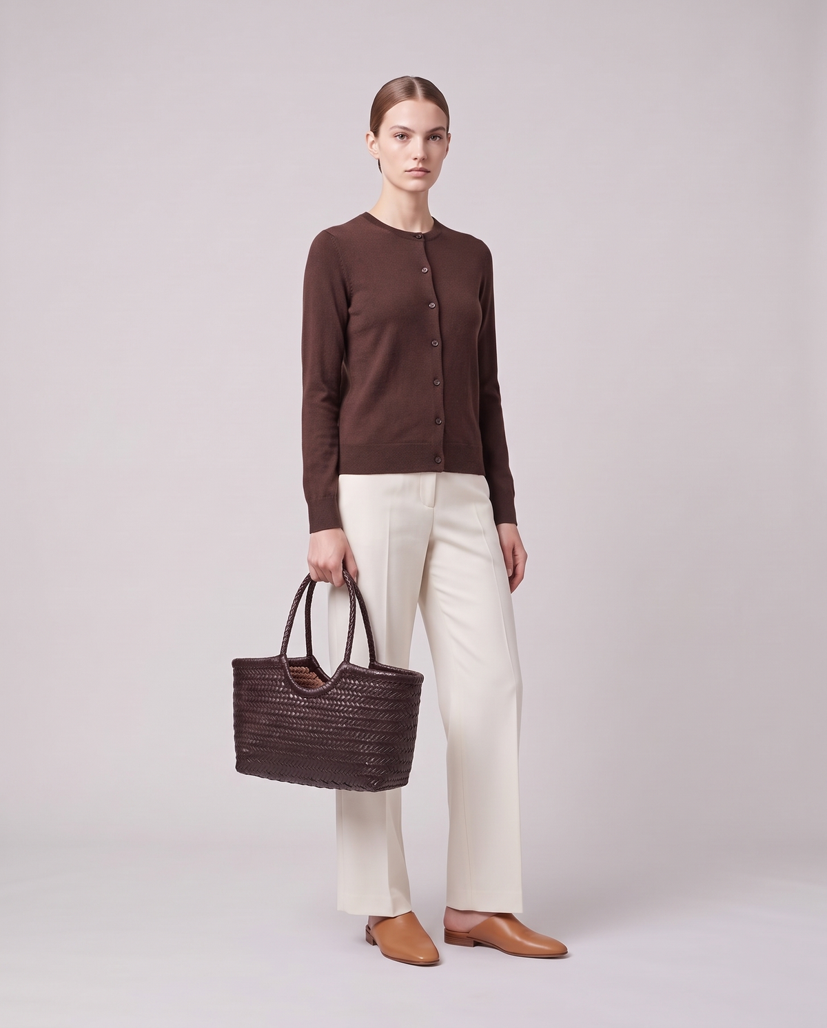 Model holding the Valentina Noto Small bag in Chocolate, full length