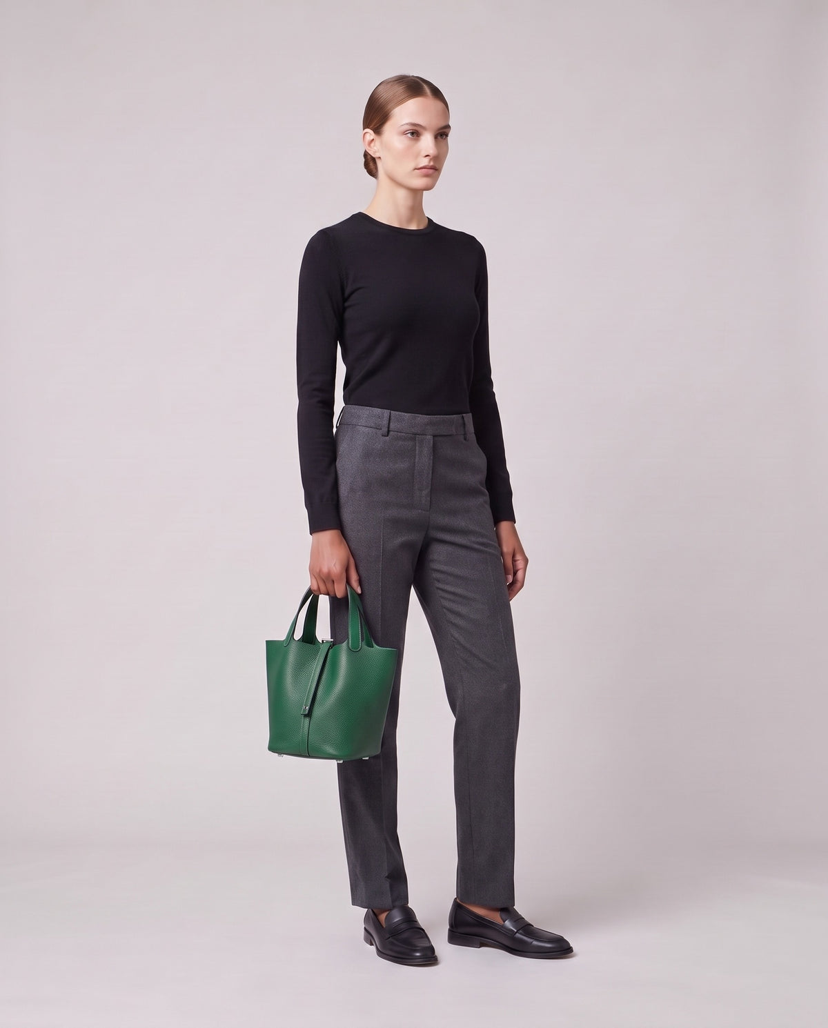 Model holding the Valentina Ostuni Large bag in Emerald, full length