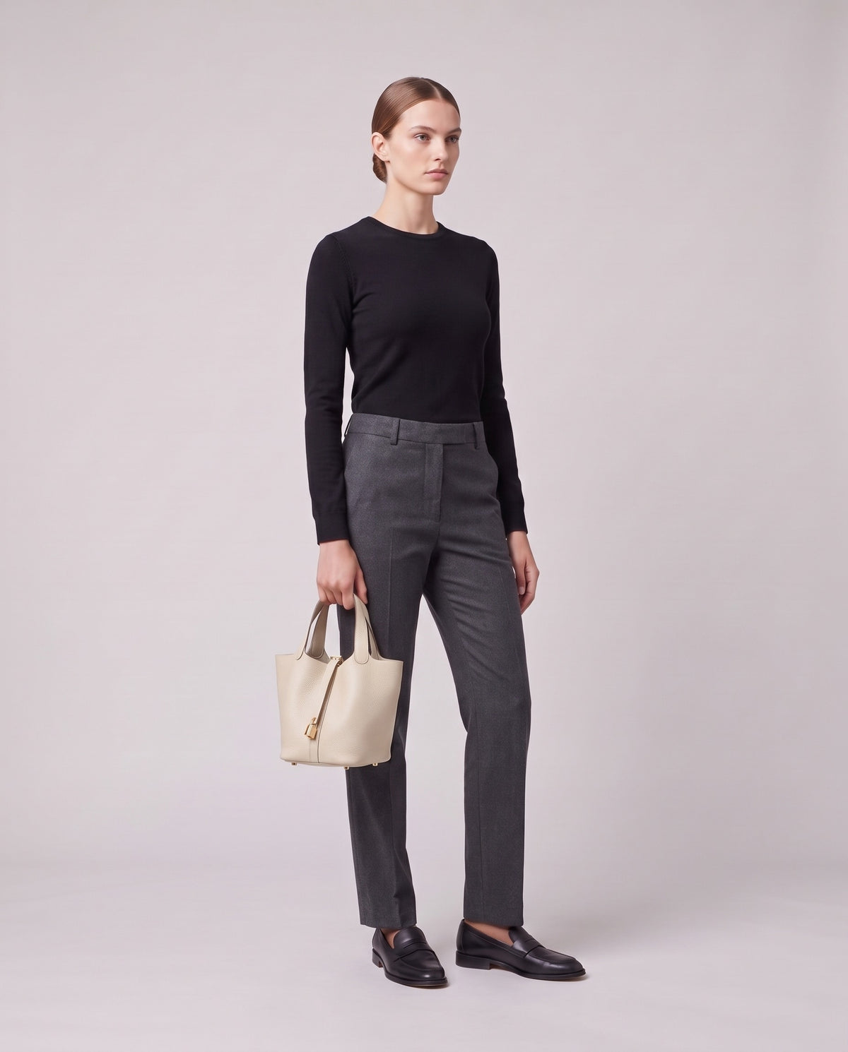 Model holding the Valentina Ostuni Large bag in Ivory, full length