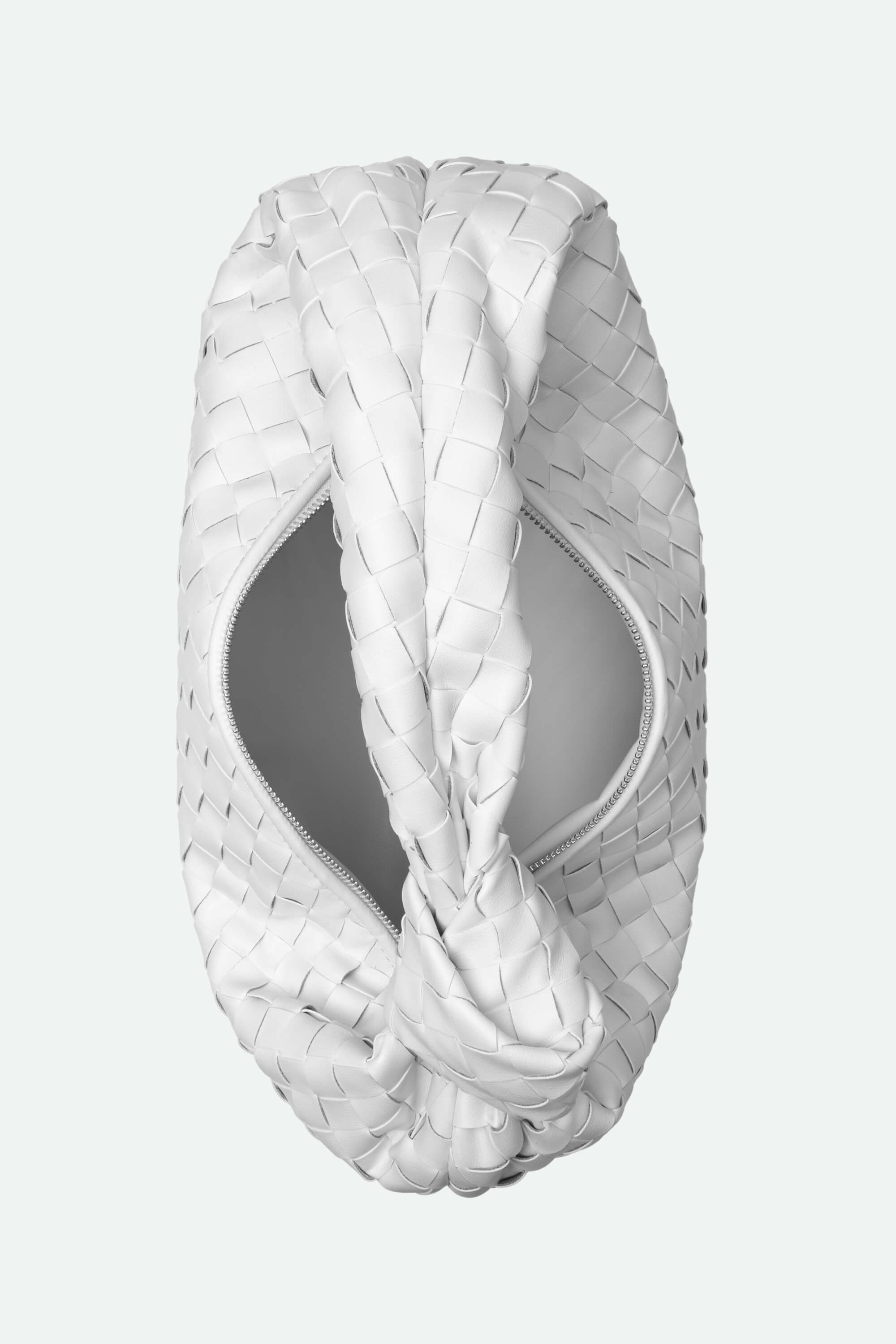 White woven headband on a light gray background