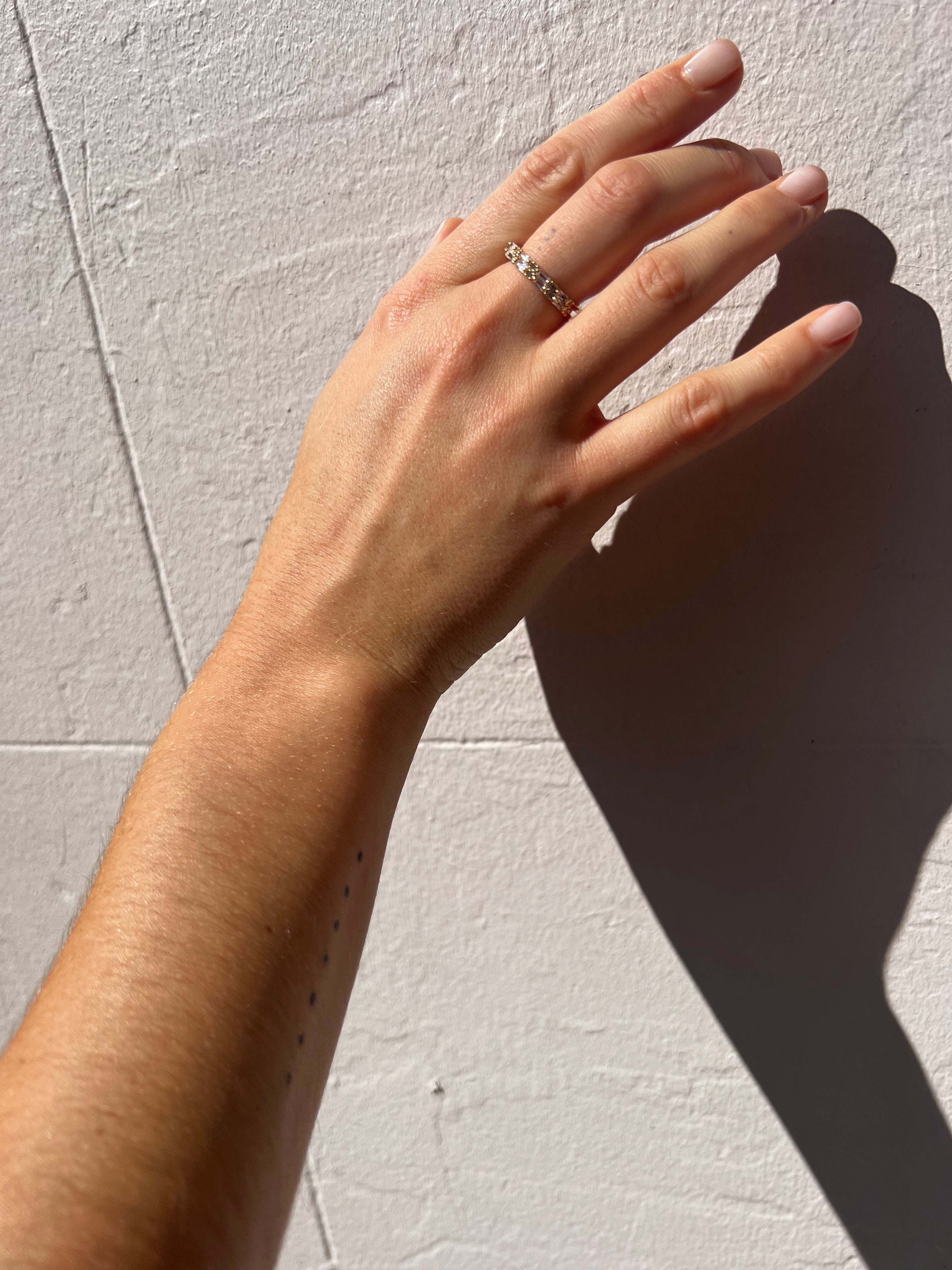 Model wearing Double gold ring with stones