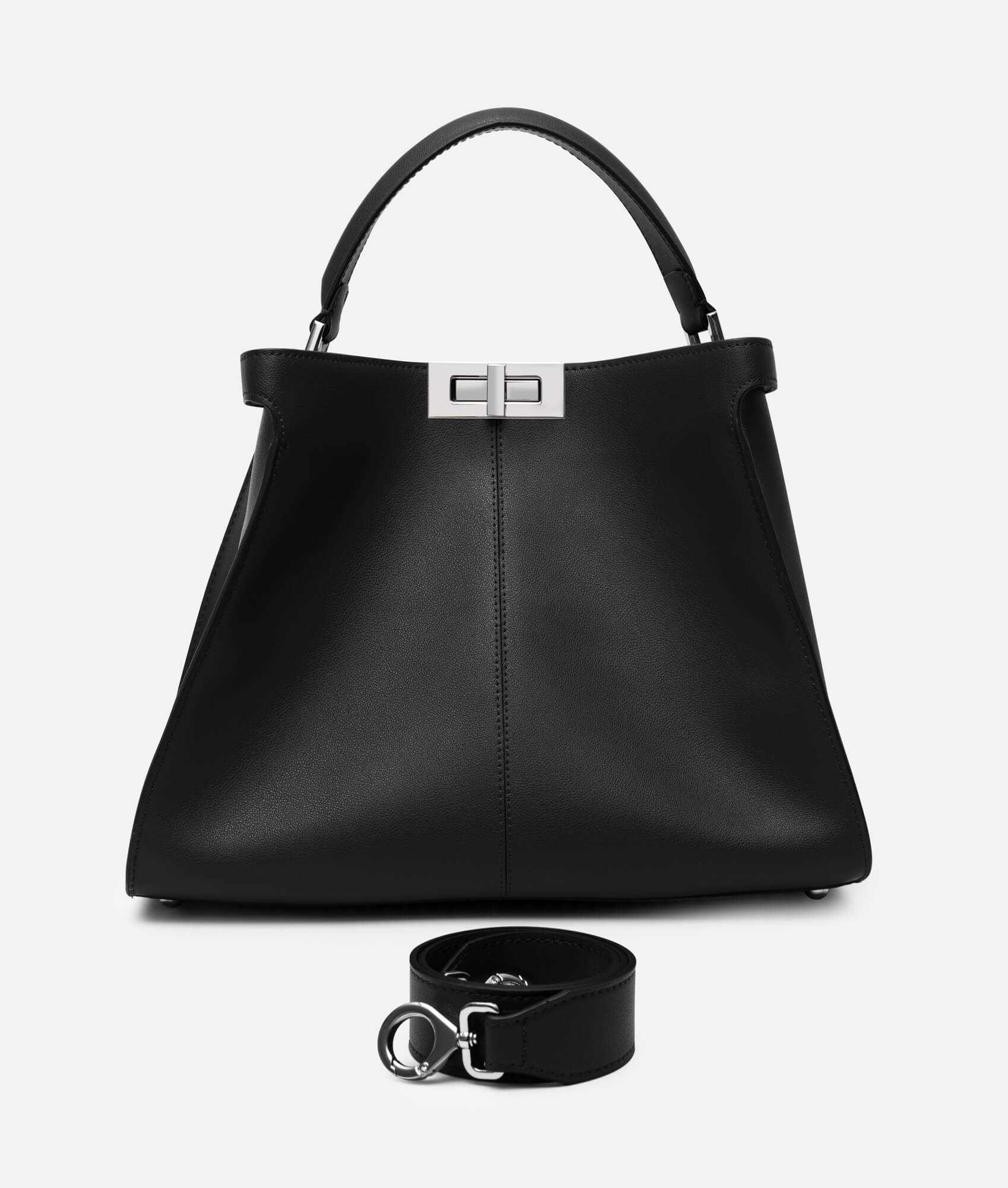 A black leather bucket bag with a metallic buckle, photographed against a white background. The bag has a sleek, elegant design and includes a detachable strap.