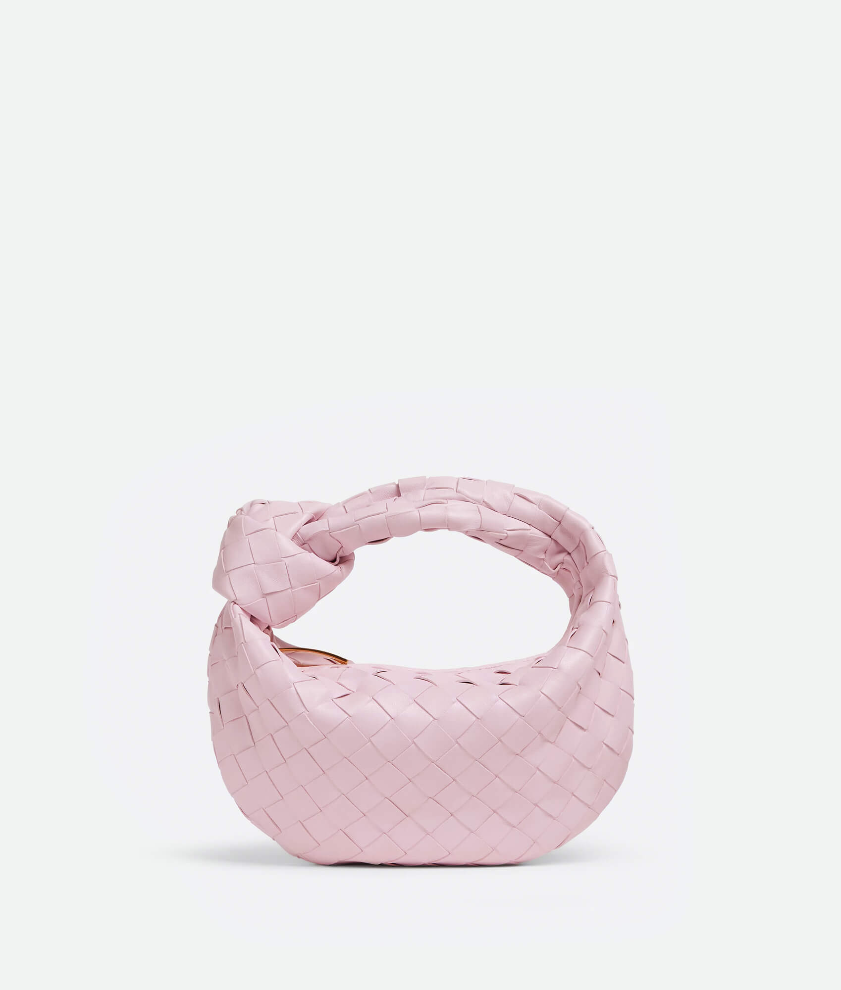 A pink woven handbag inspired by the Bottega Mini Jodie design, featuring a compact and rounded shape.