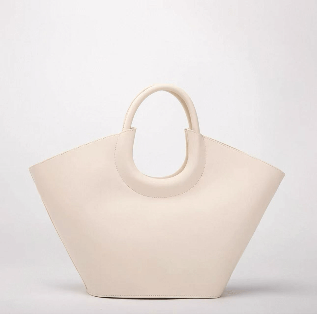 Beige handbag on a light gray background