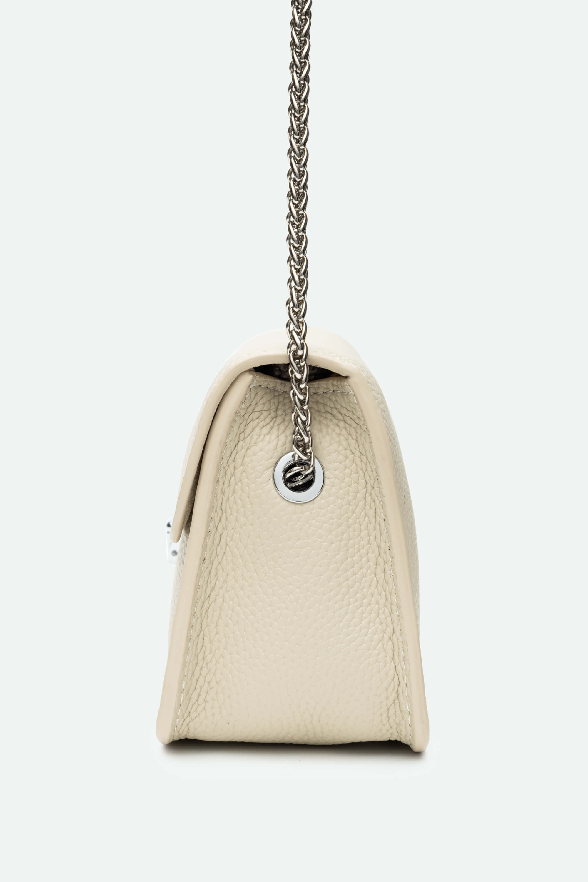 Beige handbag with a chain strap on a light gray background