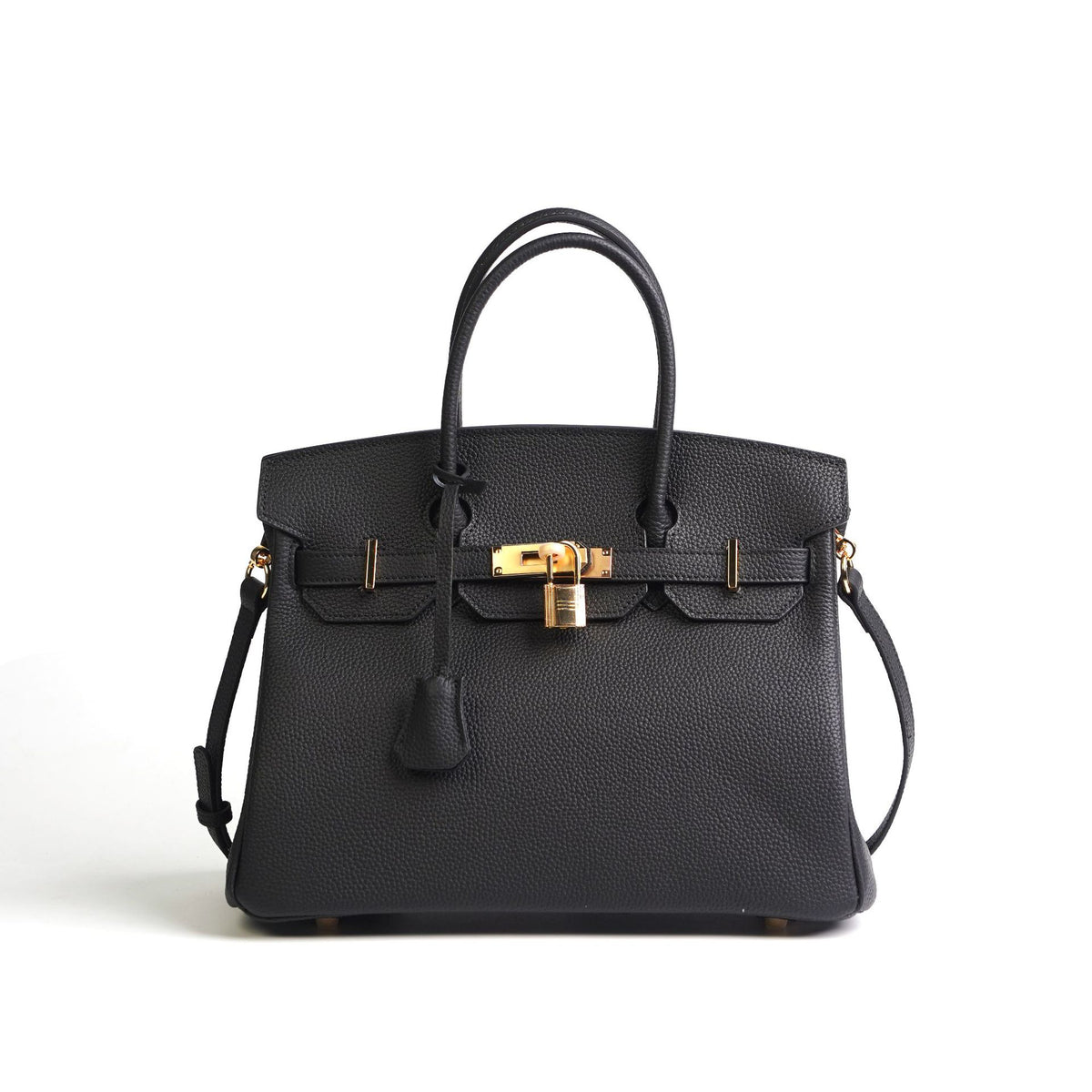 Black handbag with gold hardware on a white background