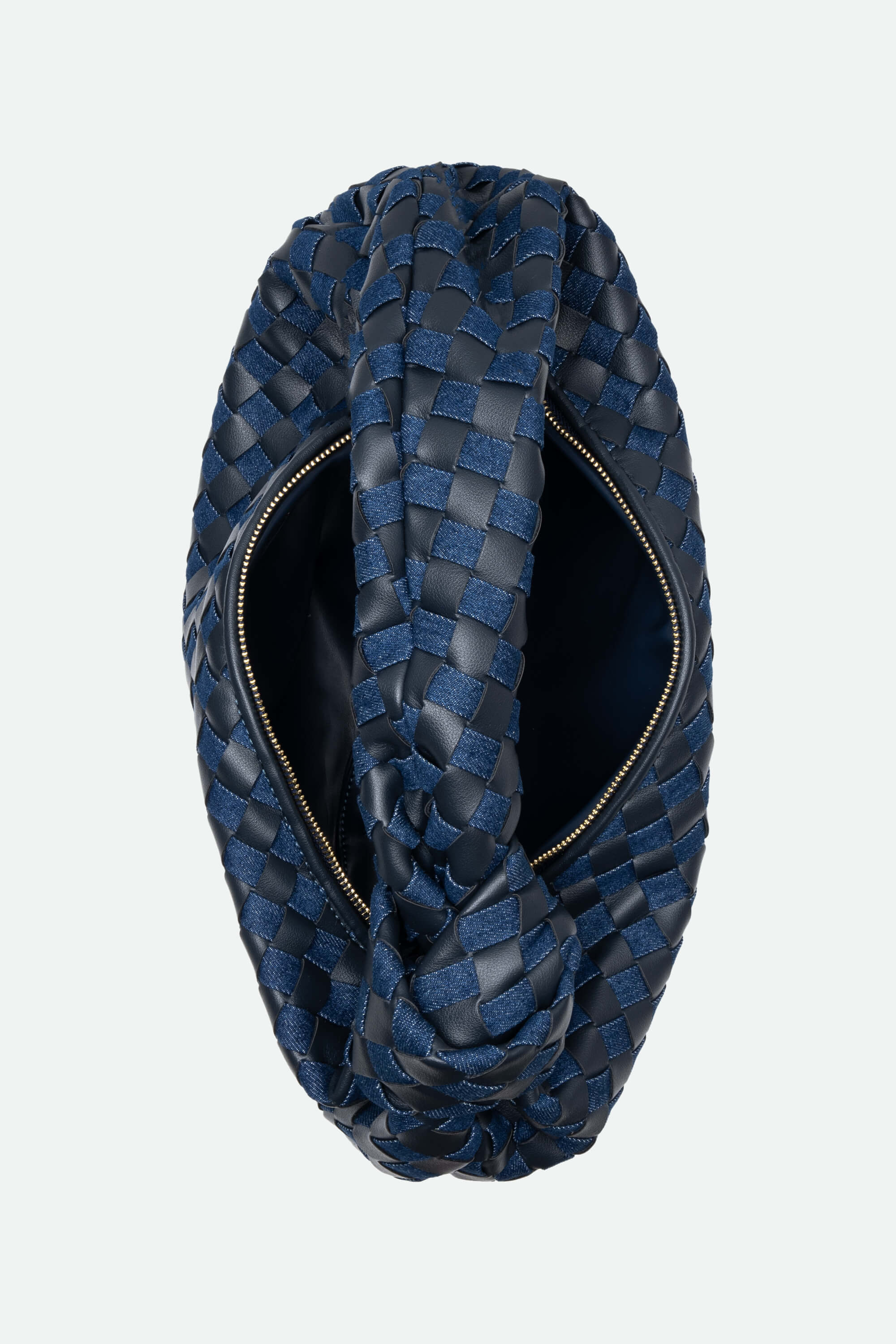 Blue woven handbag with a zipper on a light gray background