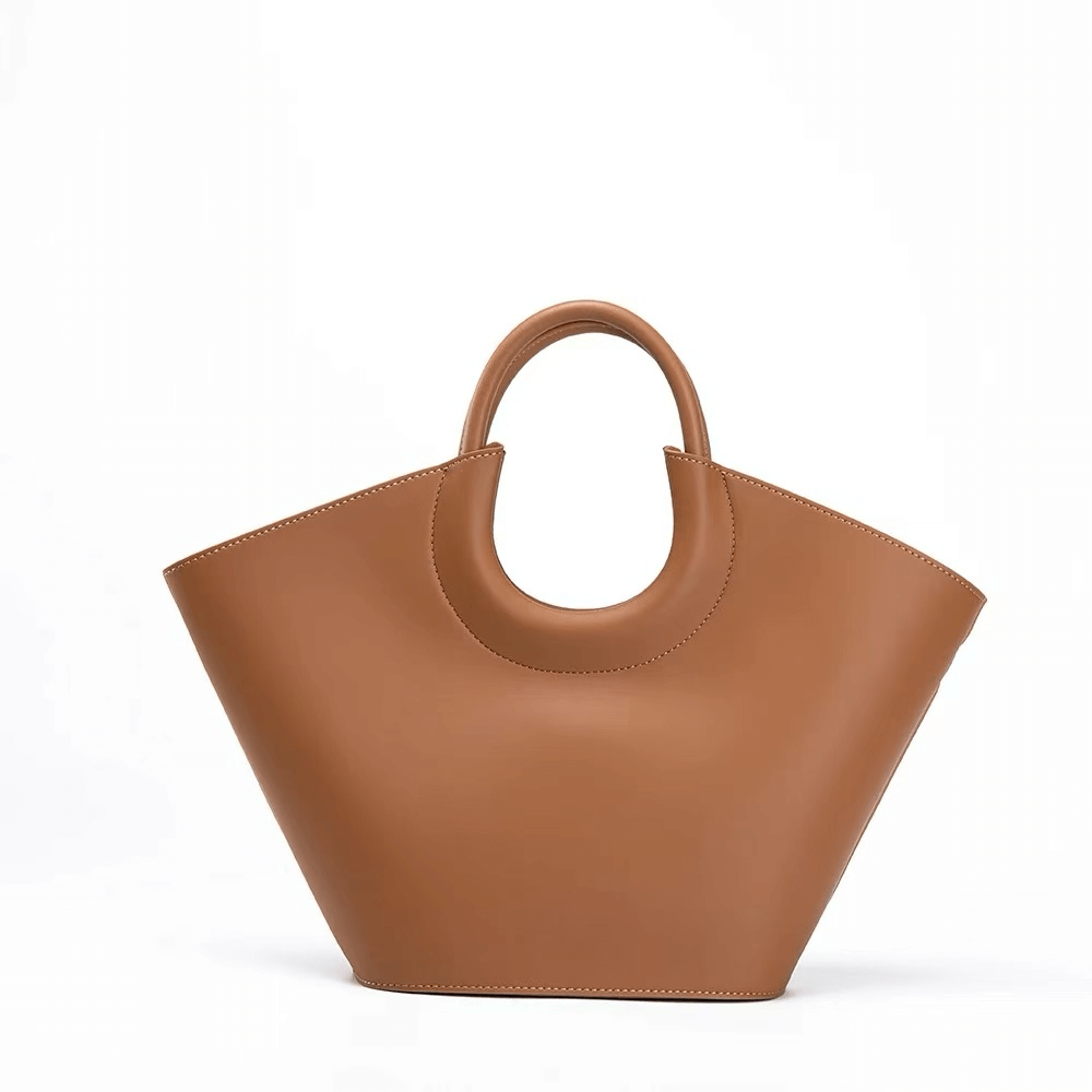 Brown handbag with a handle on a white background