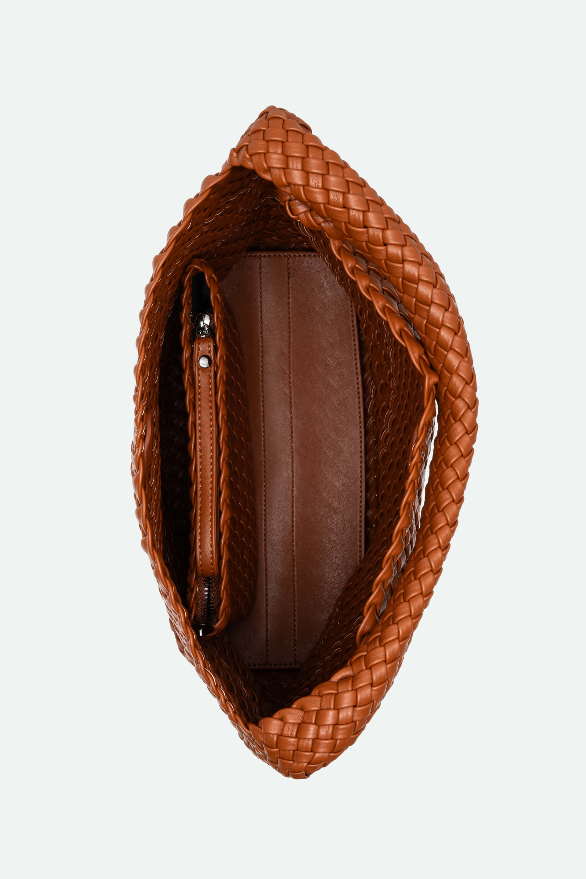 Brown woven handbag on a white background