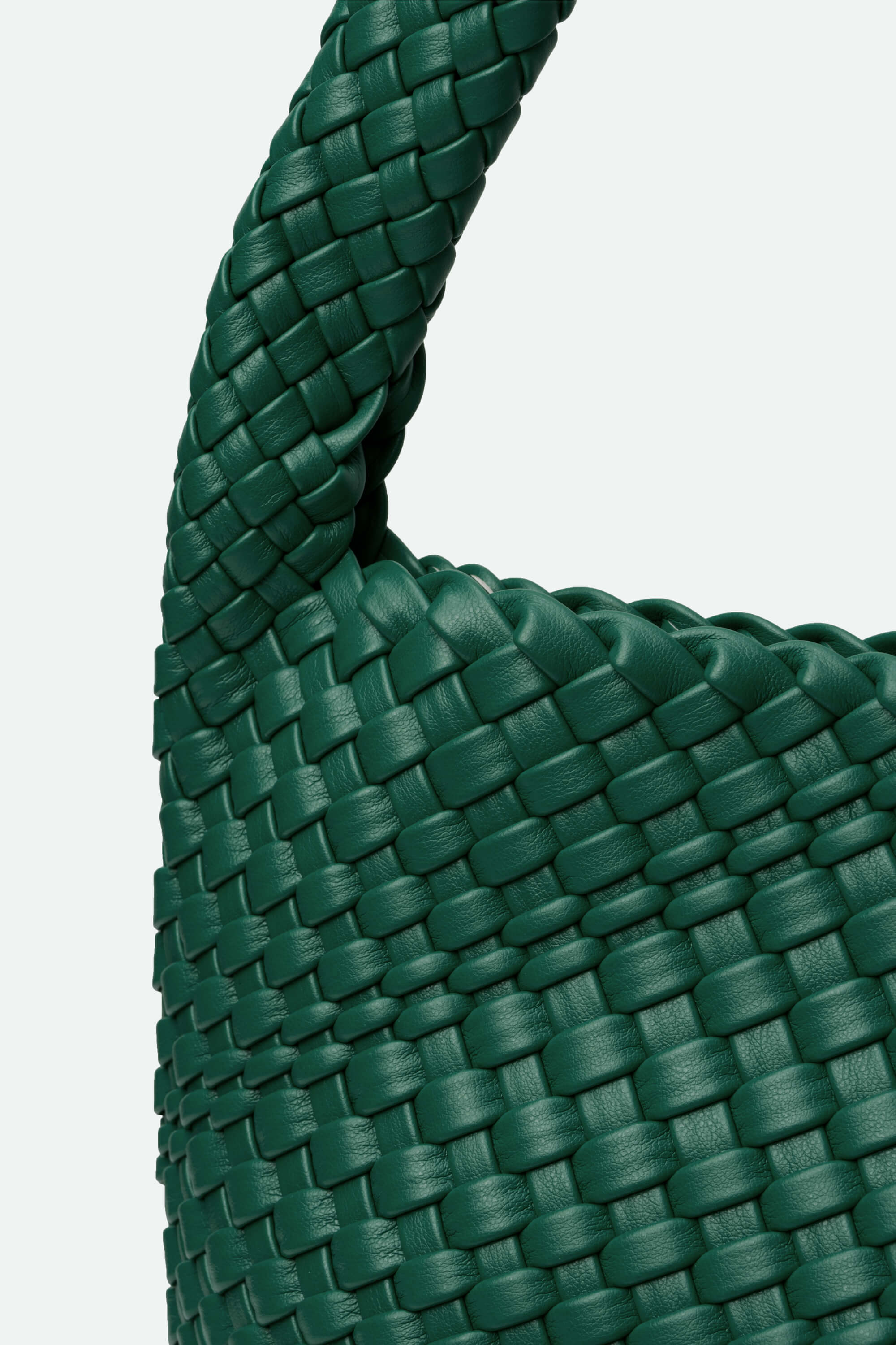 Close-up of a green woven bag on a white background