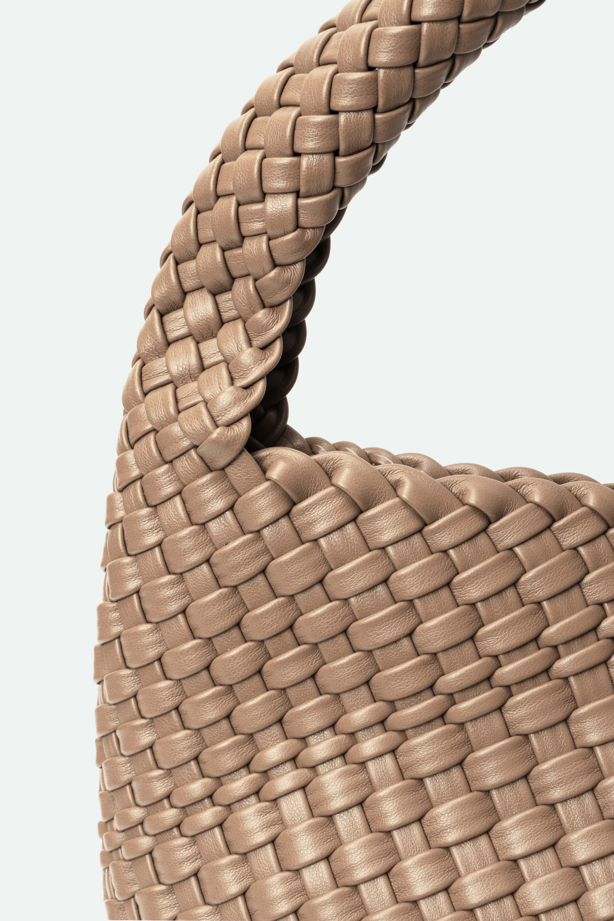 Close-up of a woven beige handbag handle on a light gray background