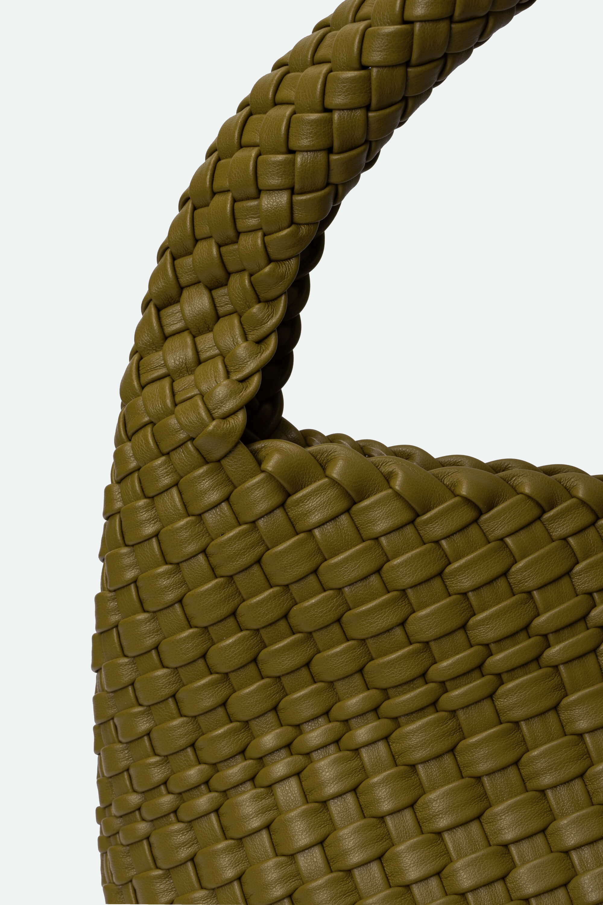 Close-up of a woven brown bag handle on a white background
