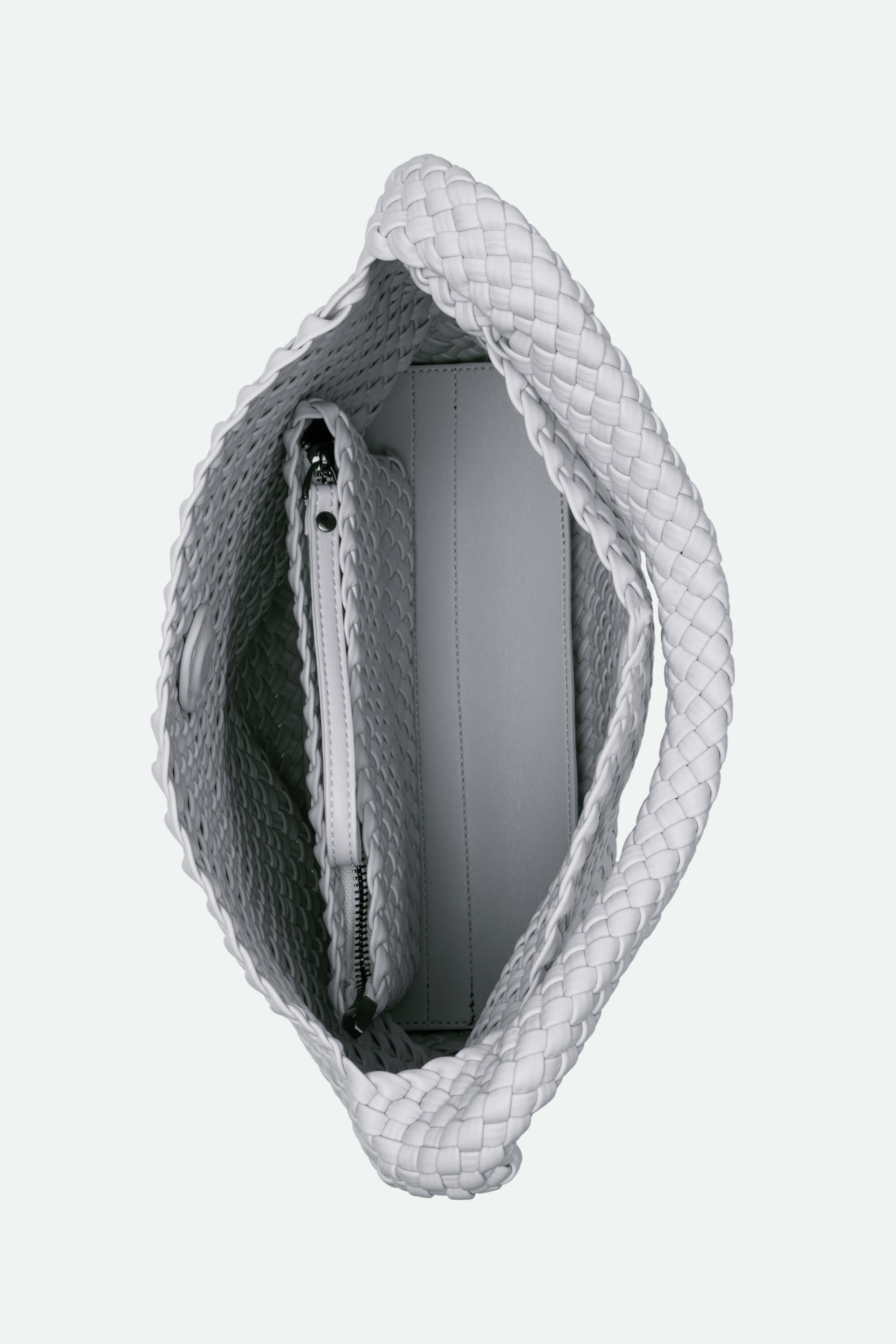 Gray textured handbag with a zipper on a light gray background