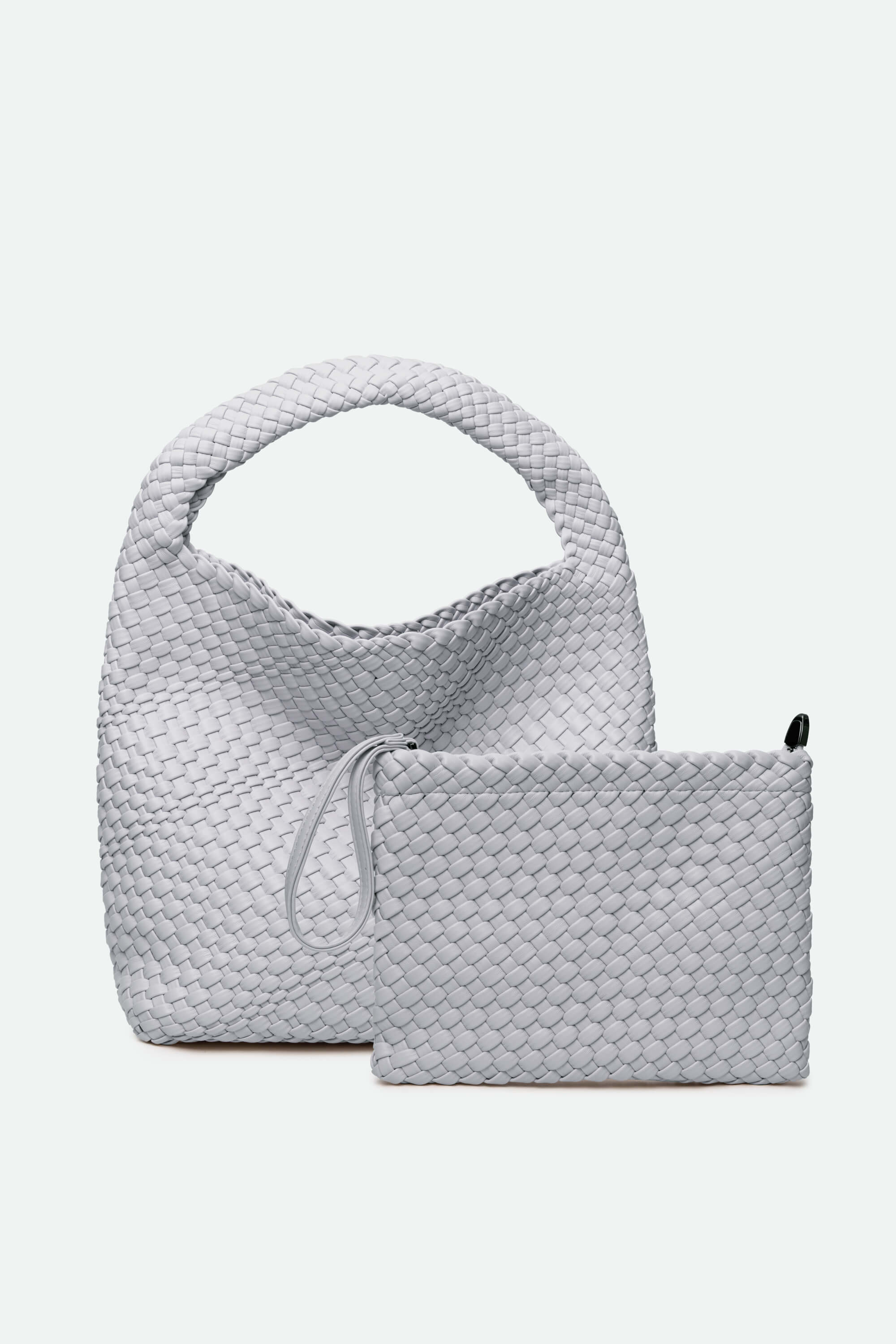 Gray textured handbag with matching pouch on a light gray background