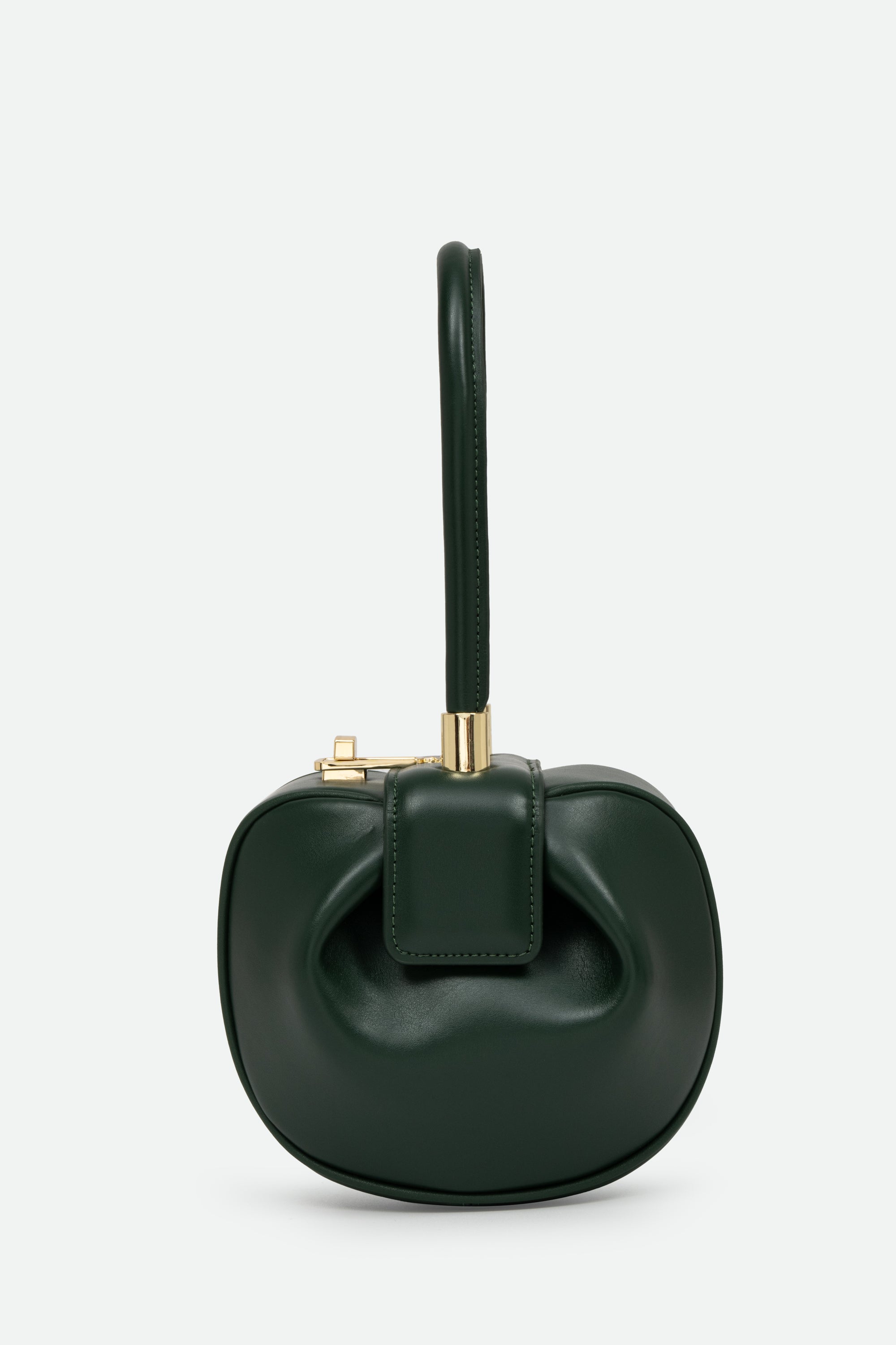 Green handbag with a gold clasp on a light gray background