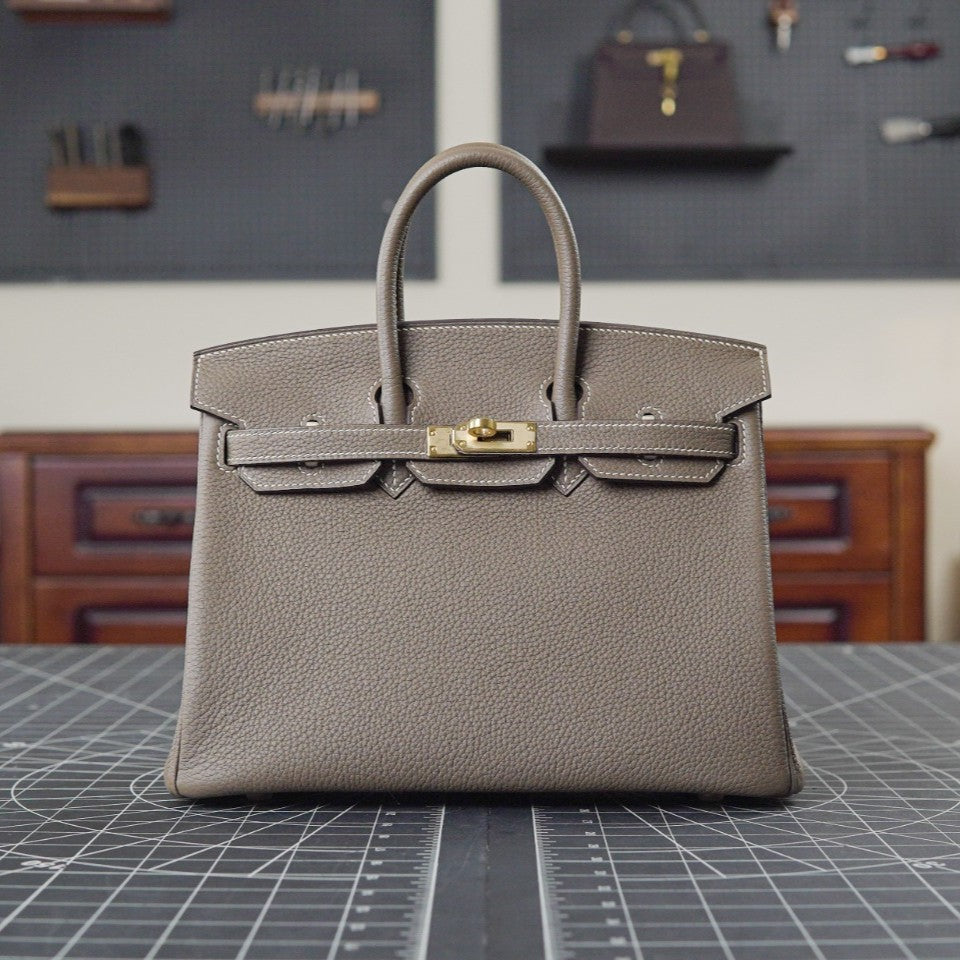 Taupe Lock Bag front view on workbench - Valentina