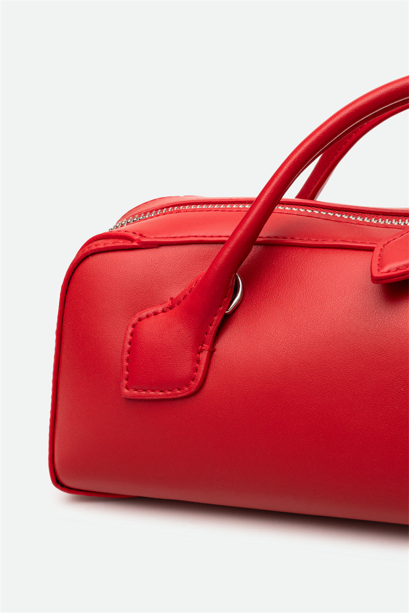 Red handbag on a white background
