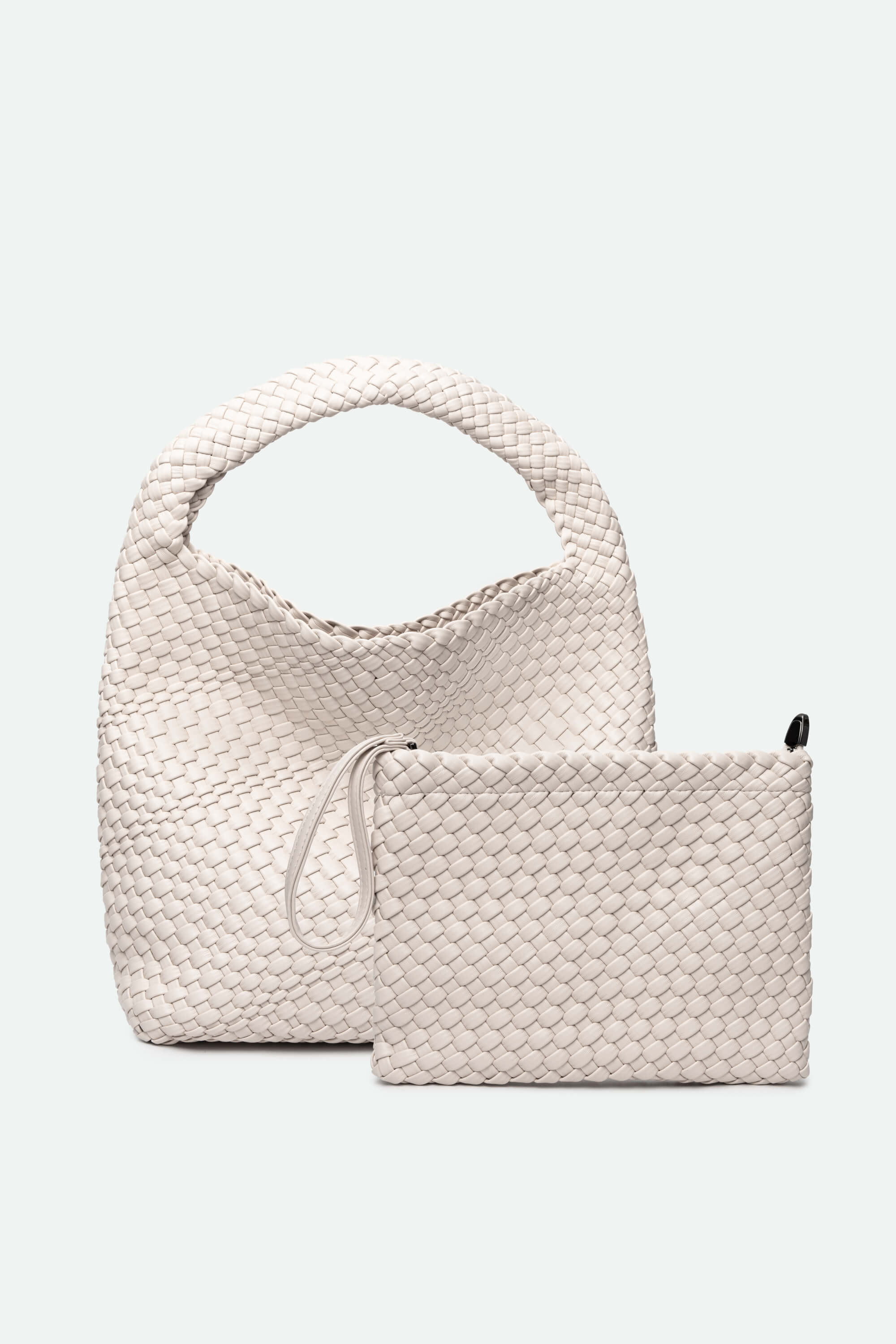 White woven handbag and pouch on a white background