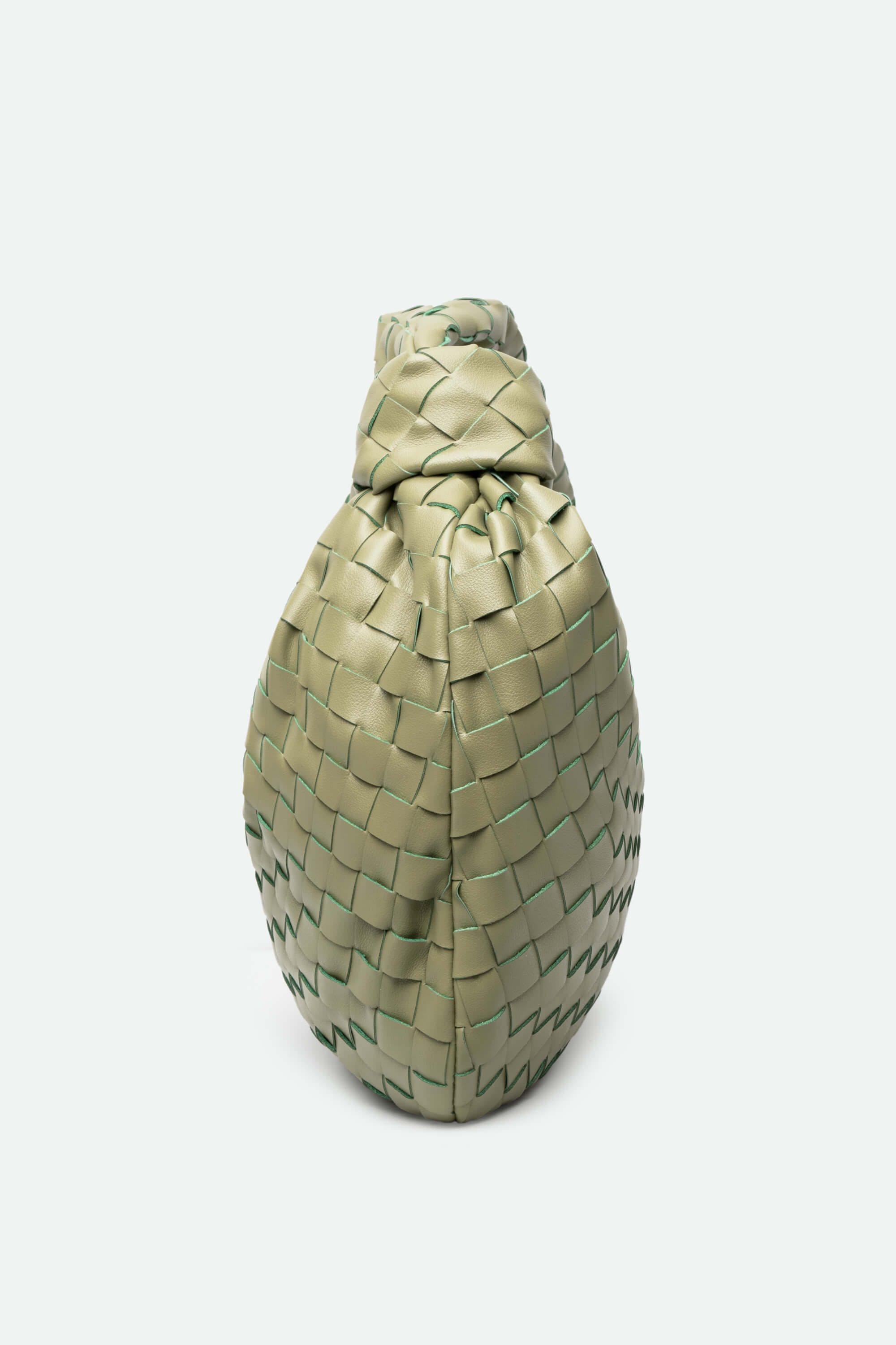 Woven green bag on a white background