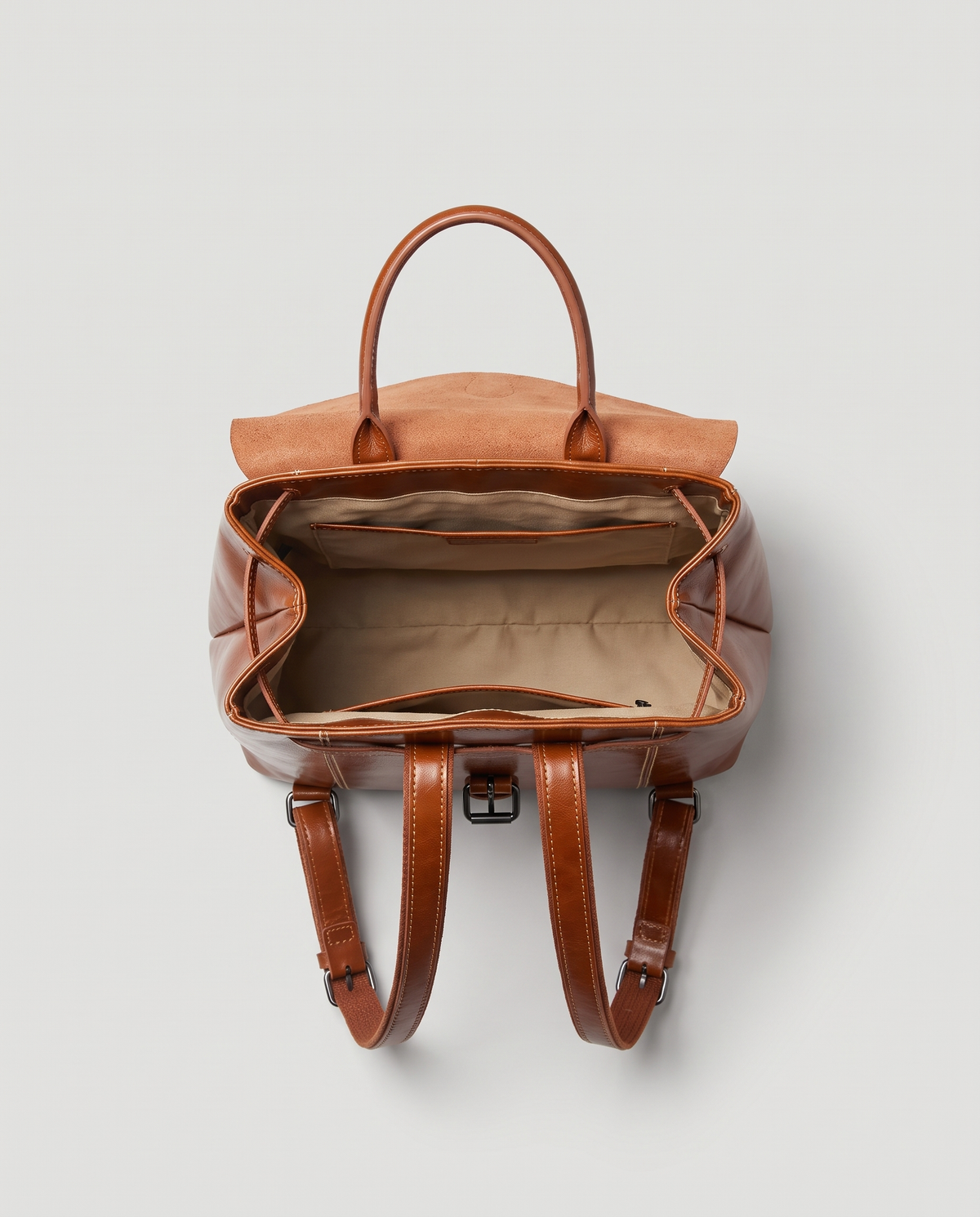 Ambler waxed leather backpack in Brown – flap open, showing the lined interior