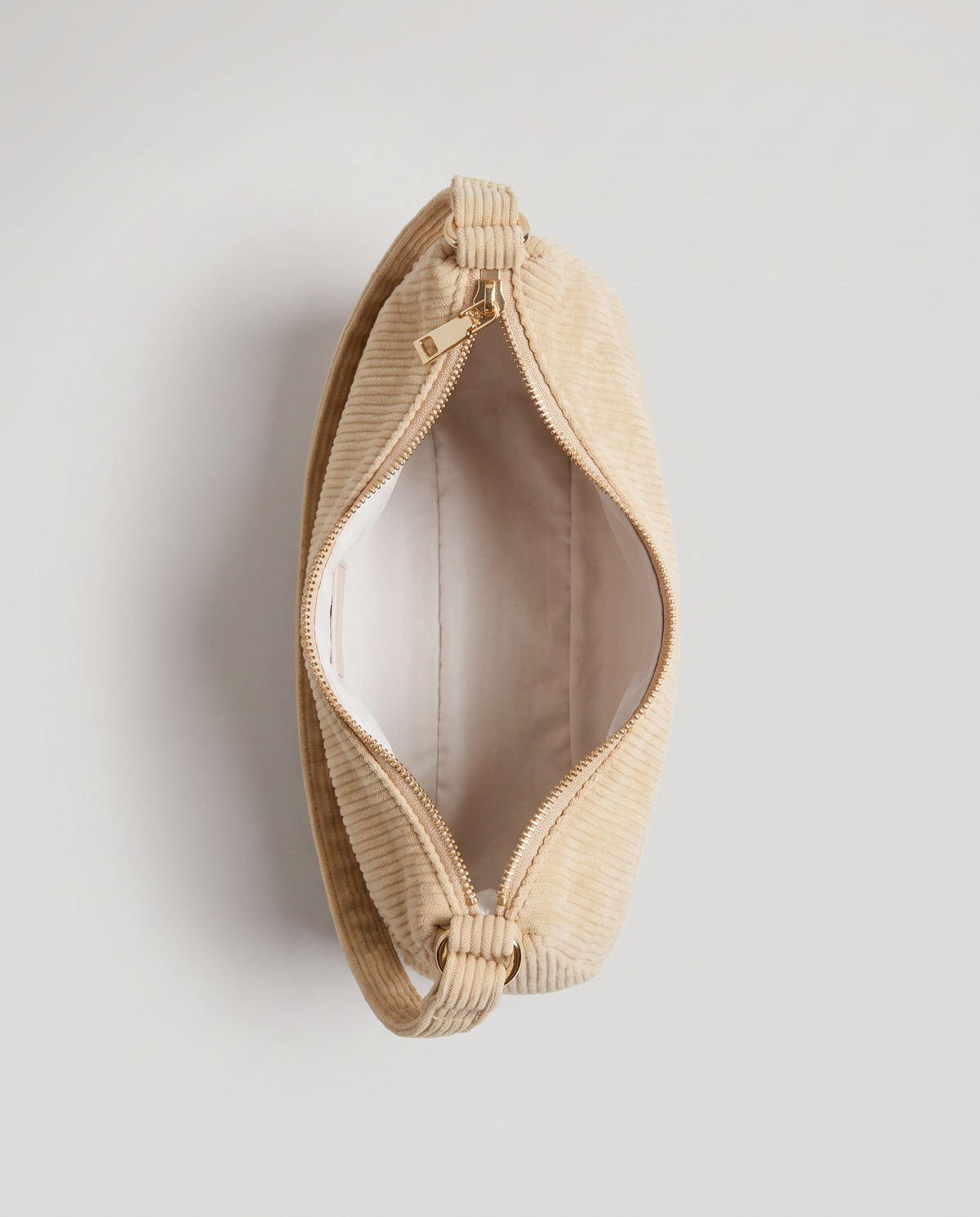 Aura corduroy shoulder bag in Beige – view from above with the zip open