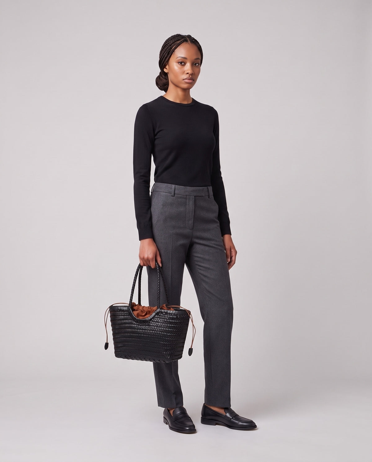 Model holding the Valentina Bosa bag in Black, full length