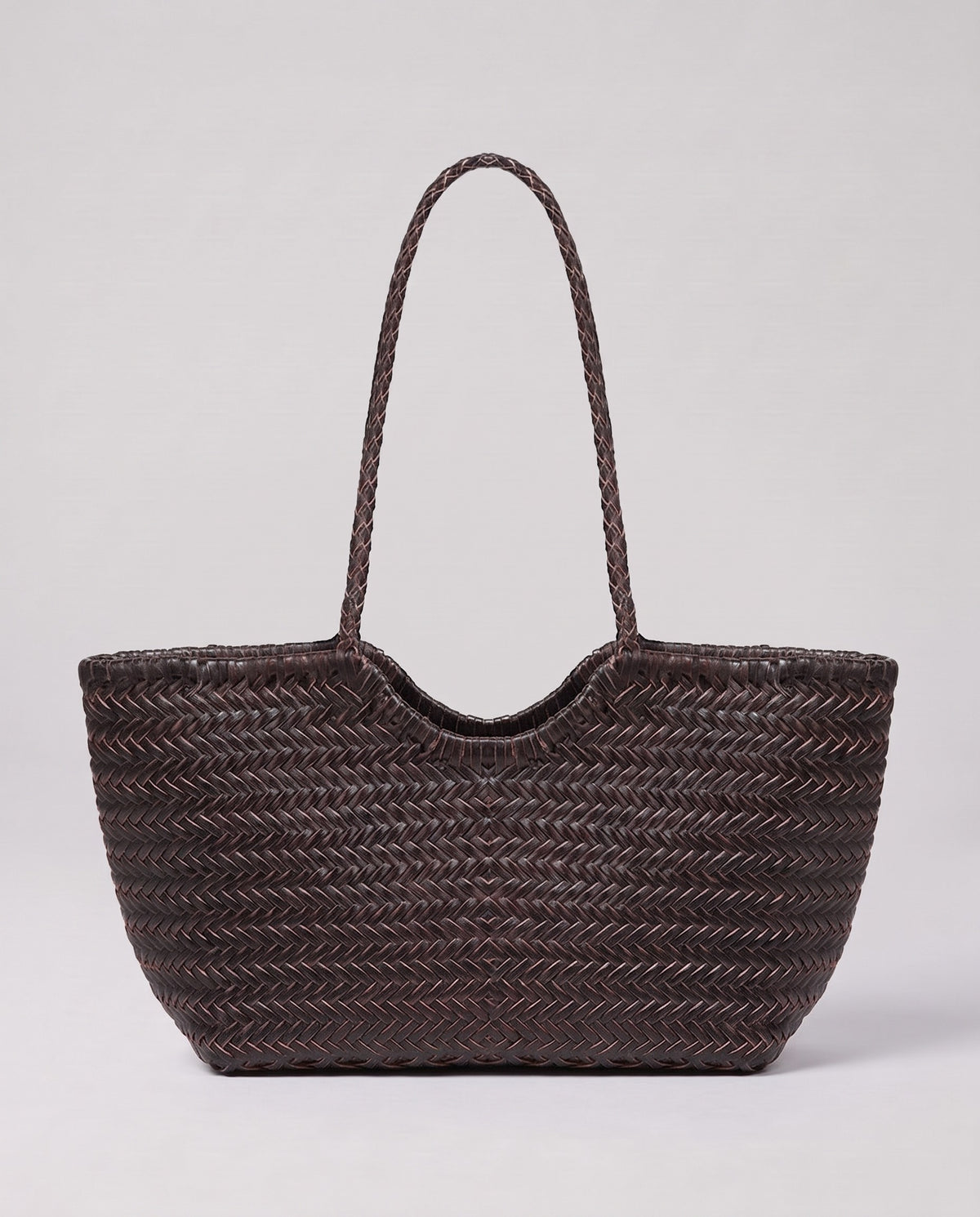 Model holding the Valentina Bosa bag in Chocolate, full length