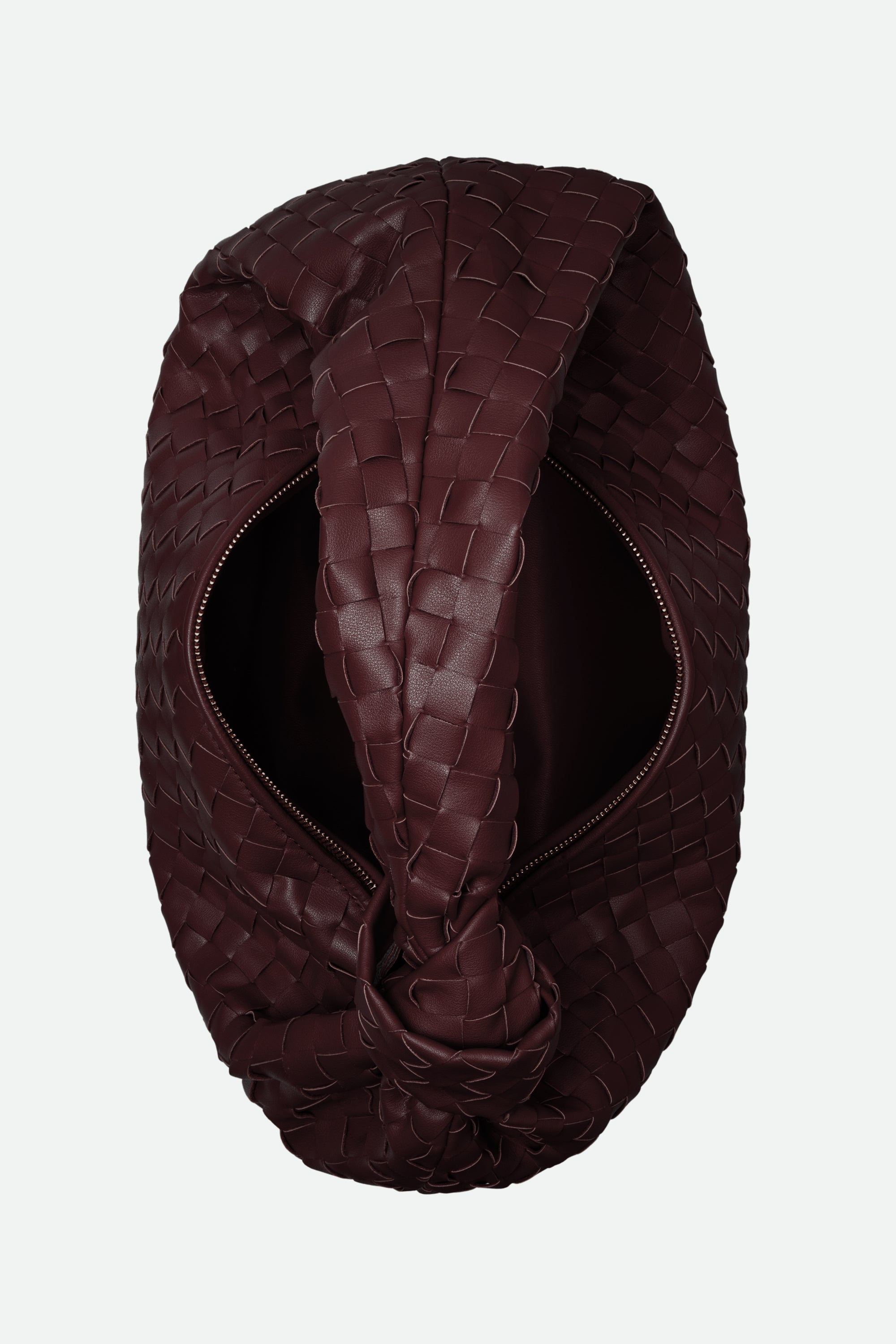 Brown leather headband with braided design on a white background