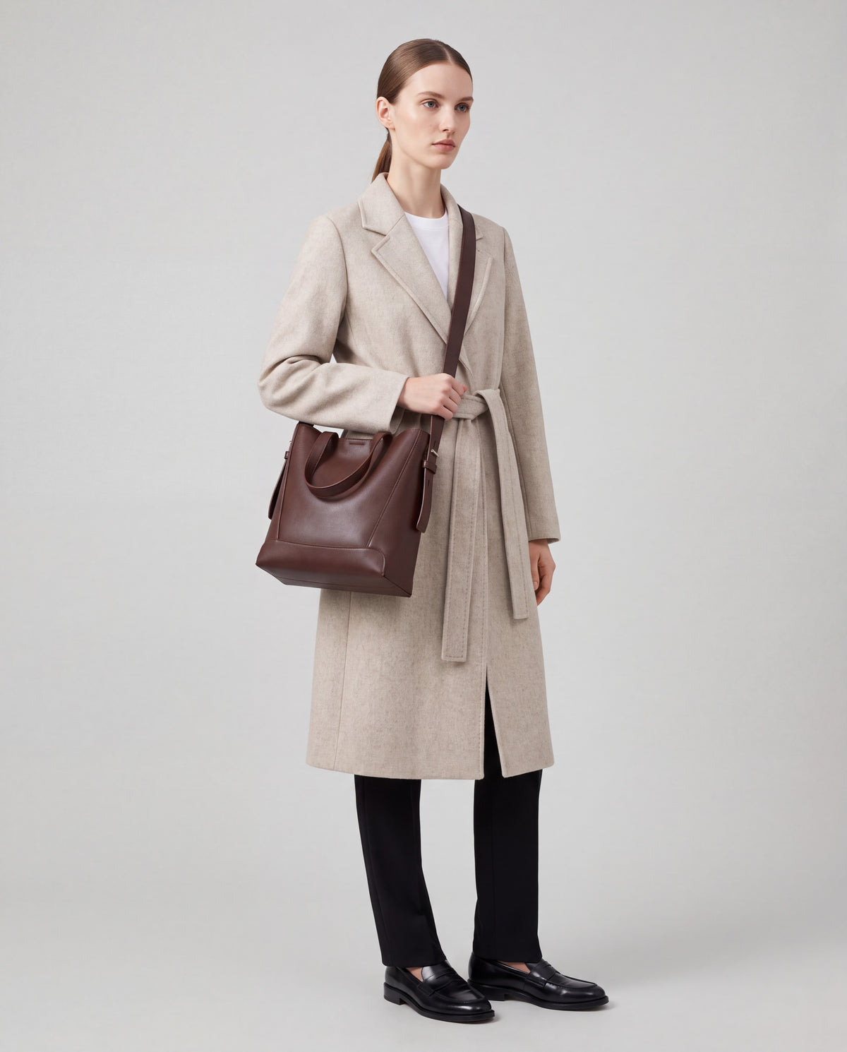 Calce bag in Chocolate – worn by model, full length
