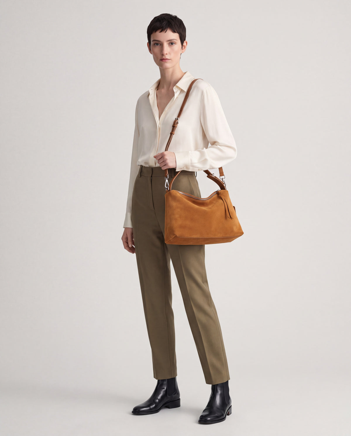 Calma bag in Camel – worn by model, full length