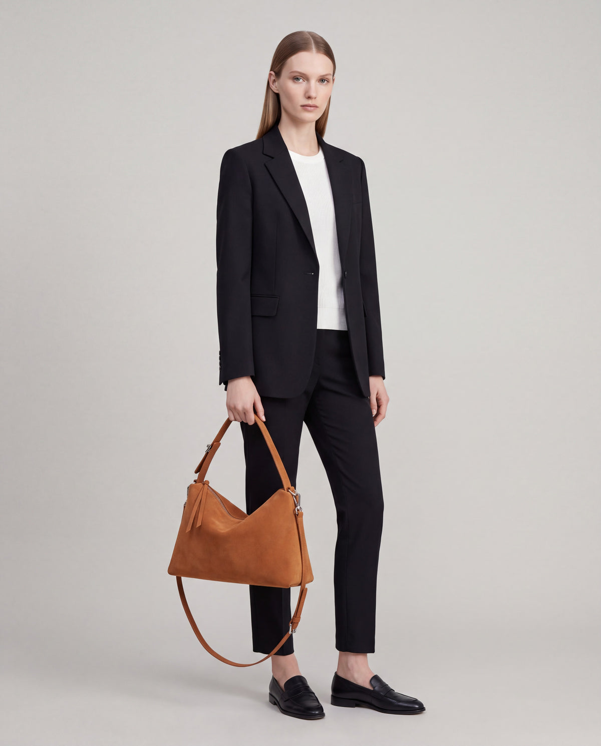 Calma bag in Caramel – worn by model, full length