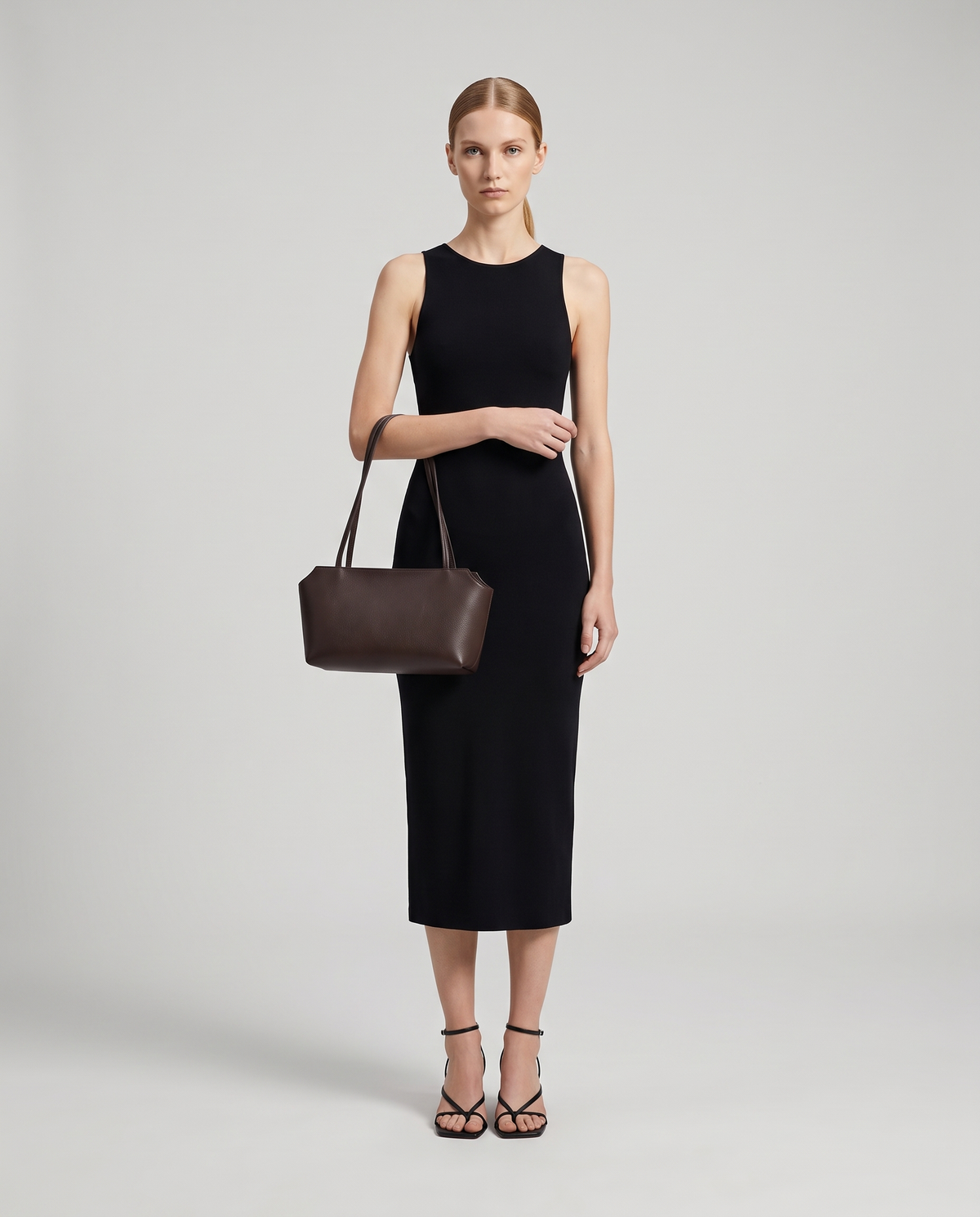 Model with the Capri leather shoulder bag in espresso, full length