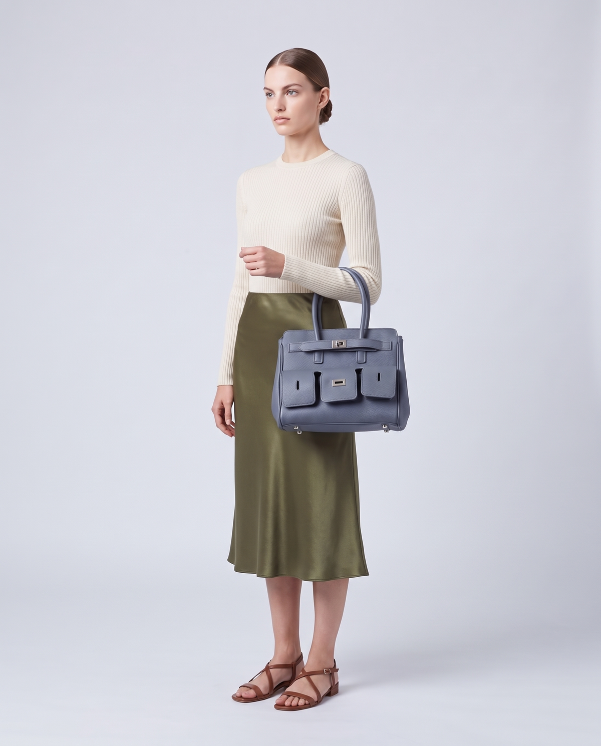 Model carrying the Capua leather tote in Denim – full length