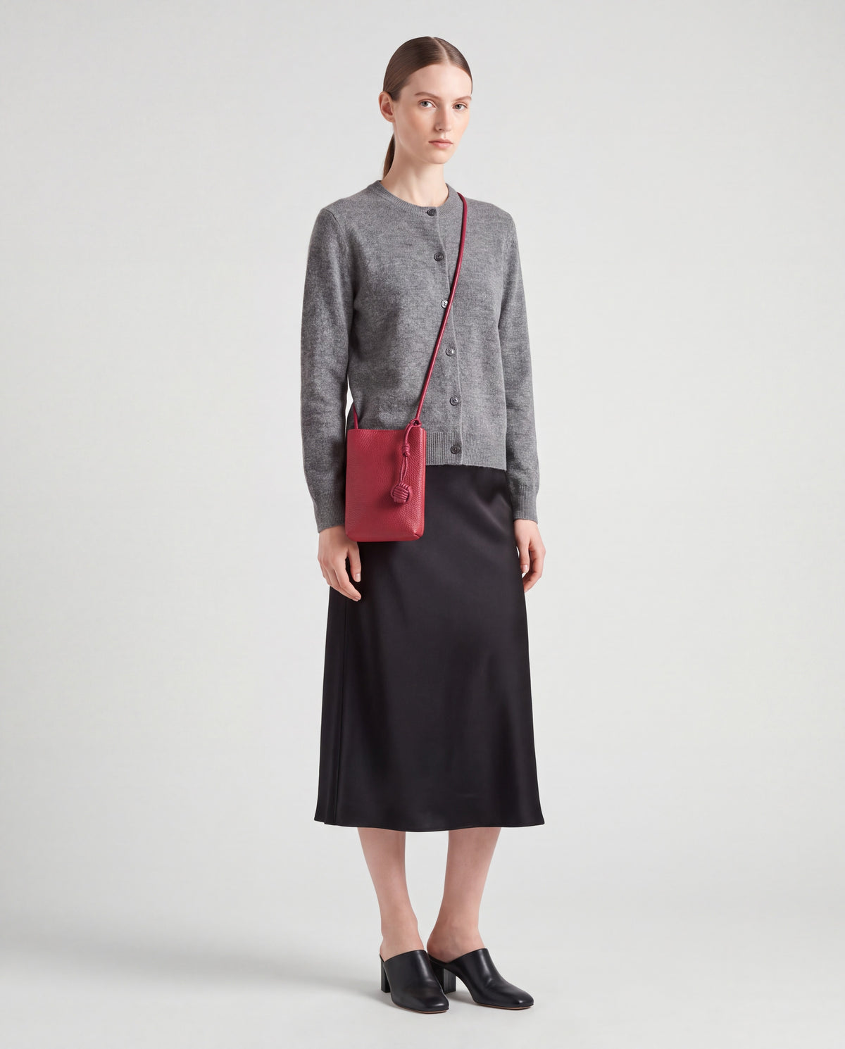 Cara bag in Cherry – worn by model, full length