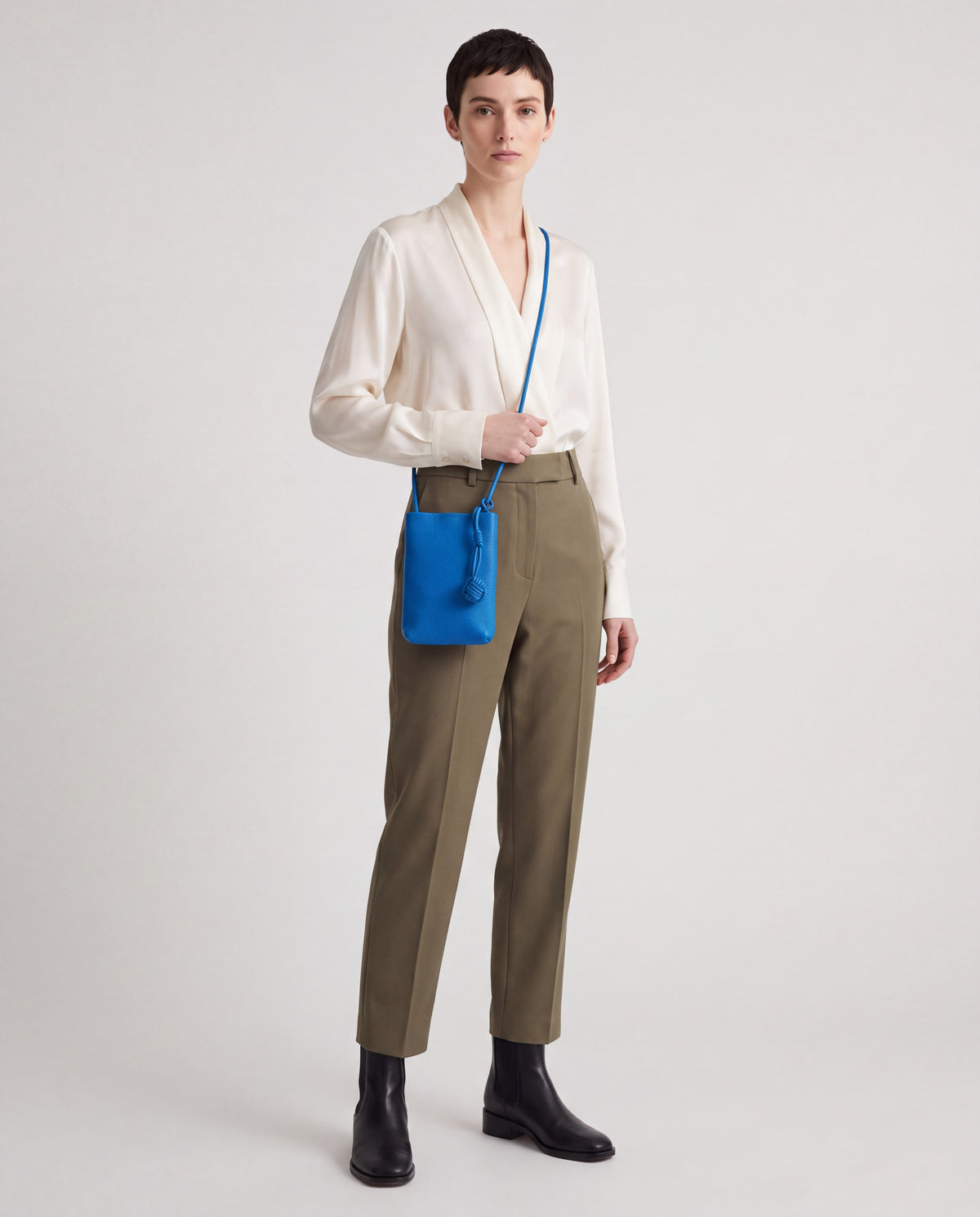 Cara bag in Cobalt – worn by model, full length