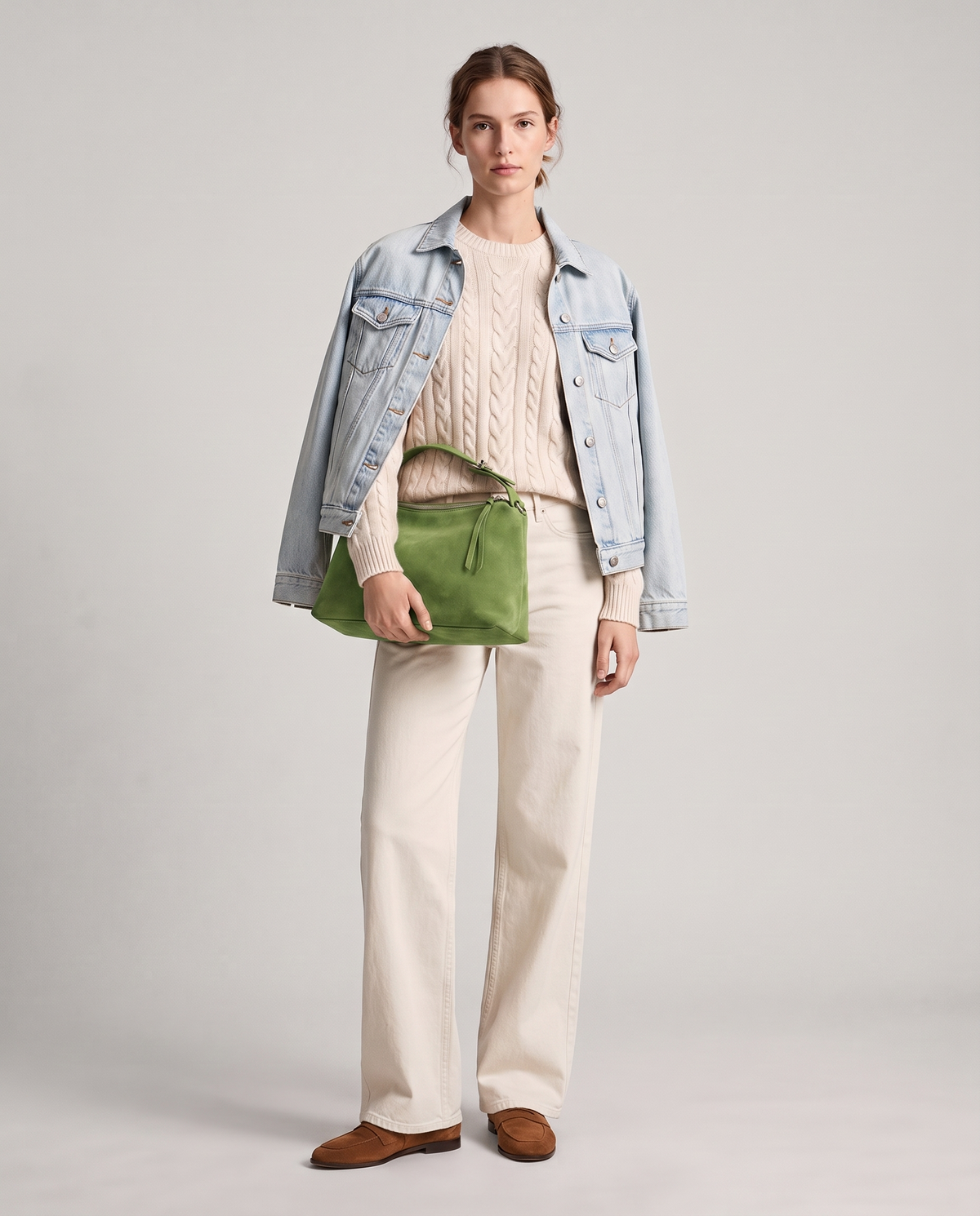 Model with the Cima suede shoulder bag in green, full length