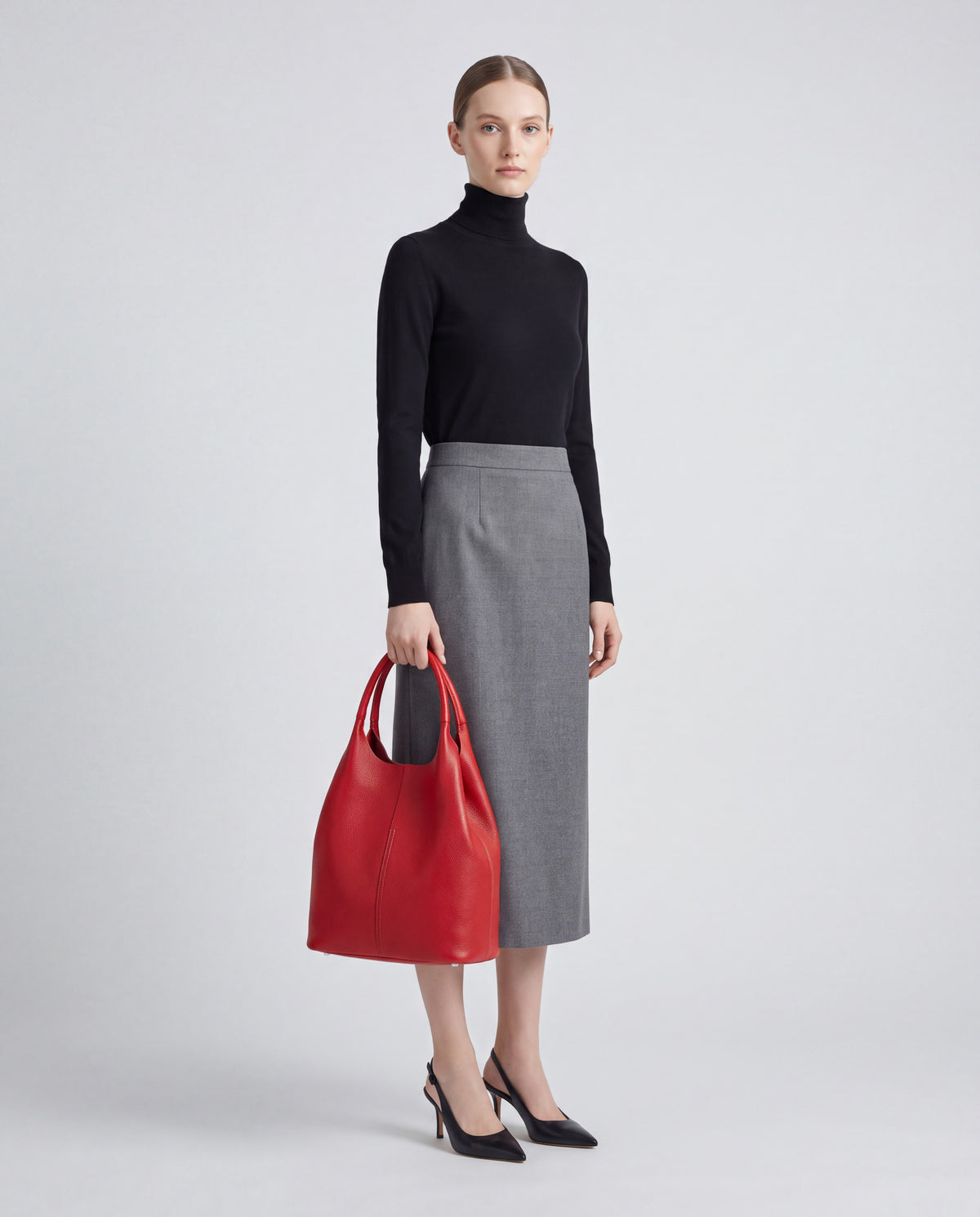 Commute bag in Red – worn by model, full length