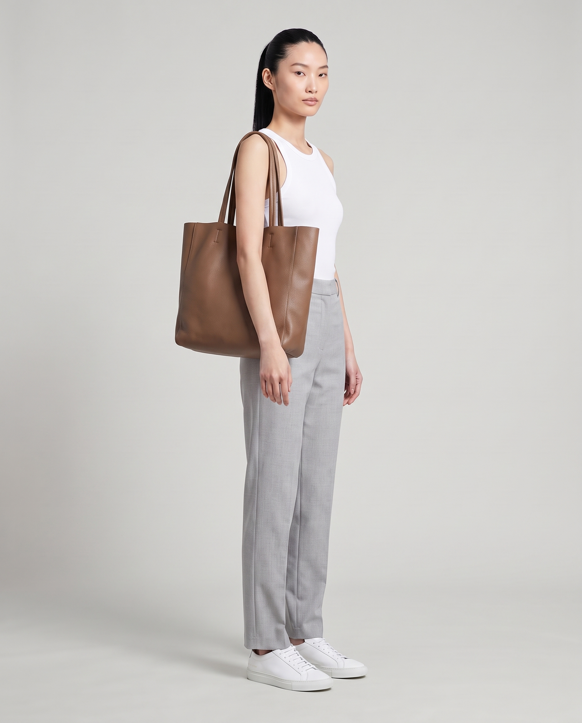 Model with the Costa leather tote in mocha, full length