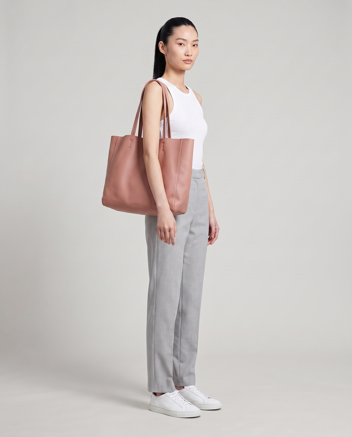 Model with the Costa leather tote in rose, full length