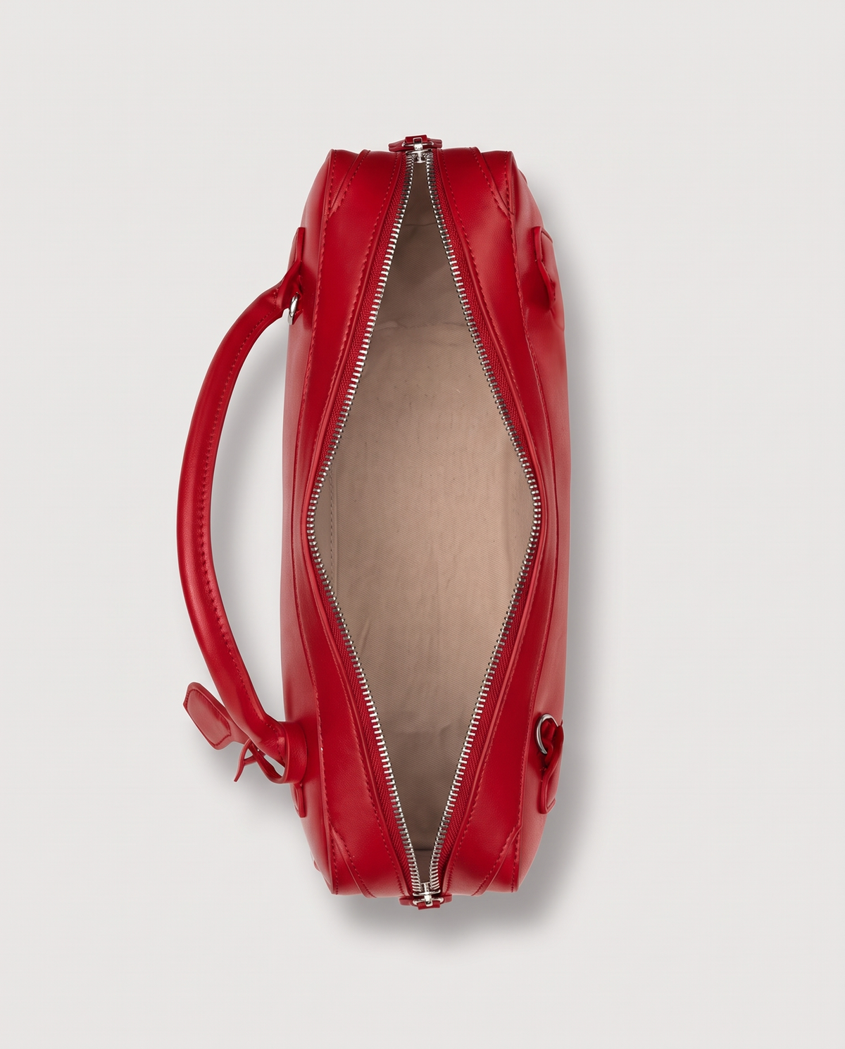 Curve leather barrel bag in Red – inside view with the zip open