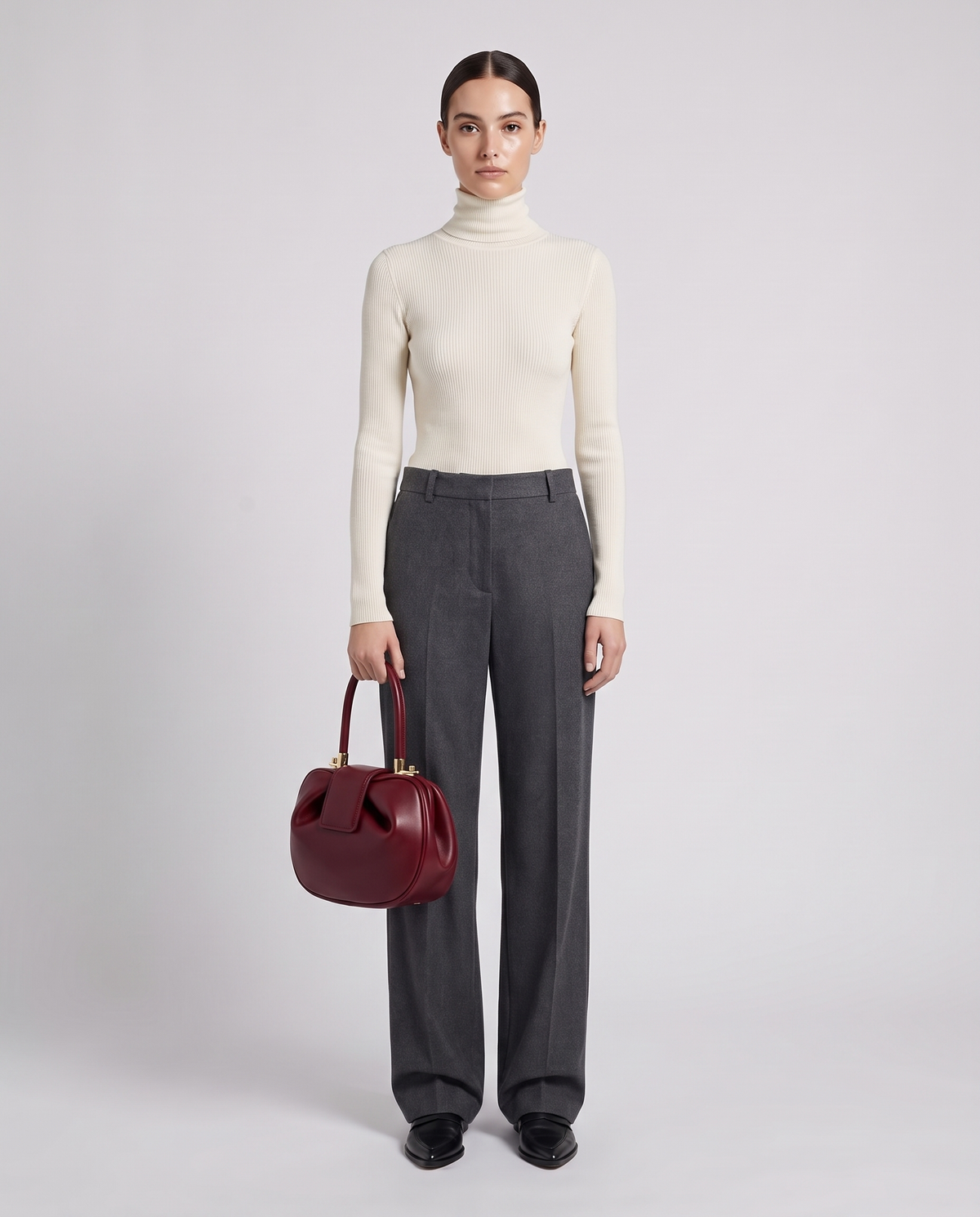 Dumpling Maxi leather top-handle bag in Red – model holding it, full length