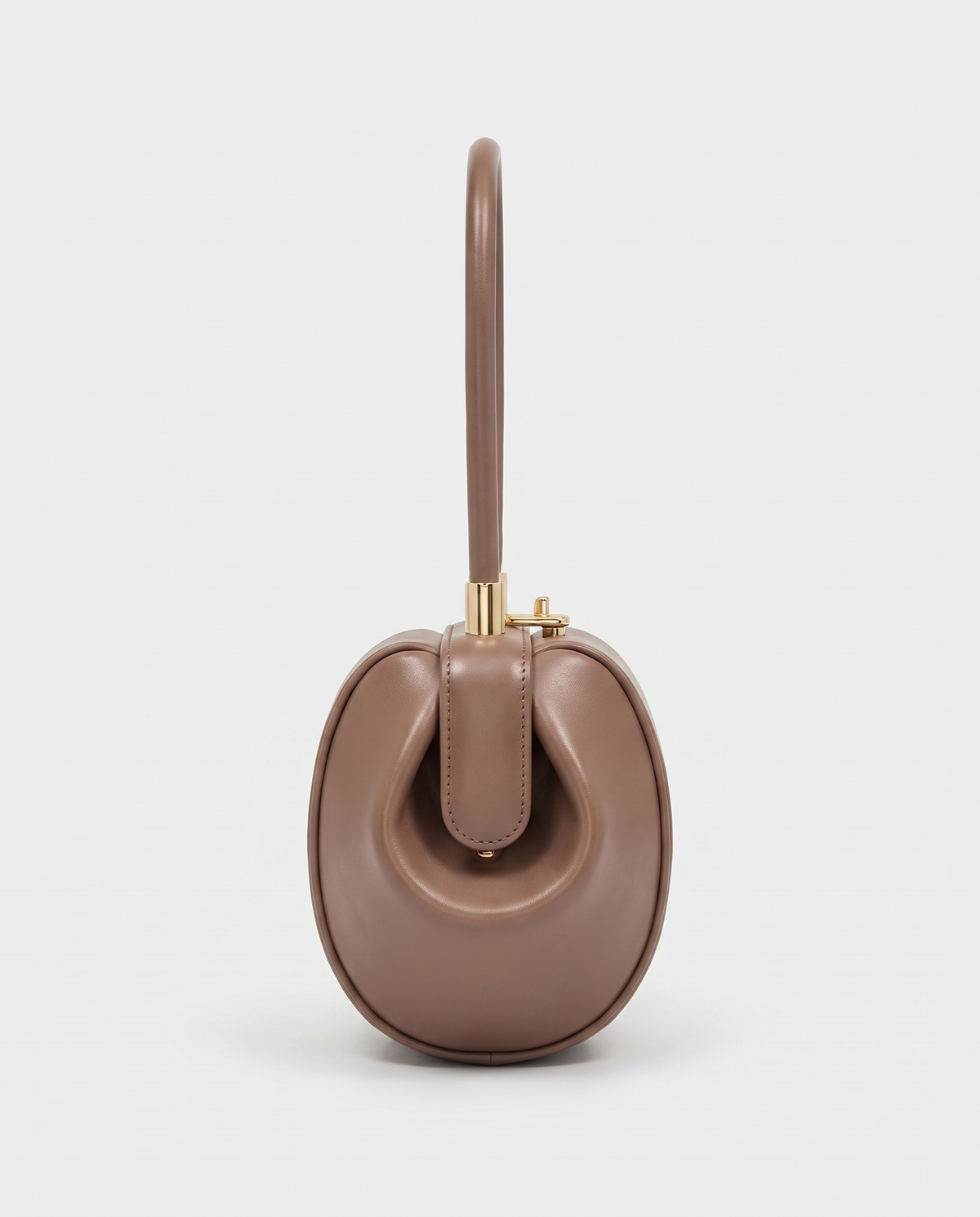 Dumpling Mini leather top-handle bag in Nude – side view