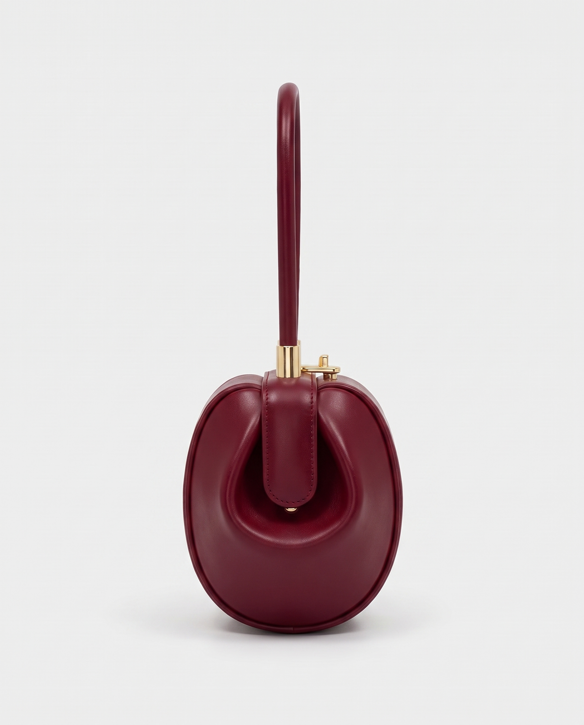 Dumpling Mini leather top-handle bag in Red – side view