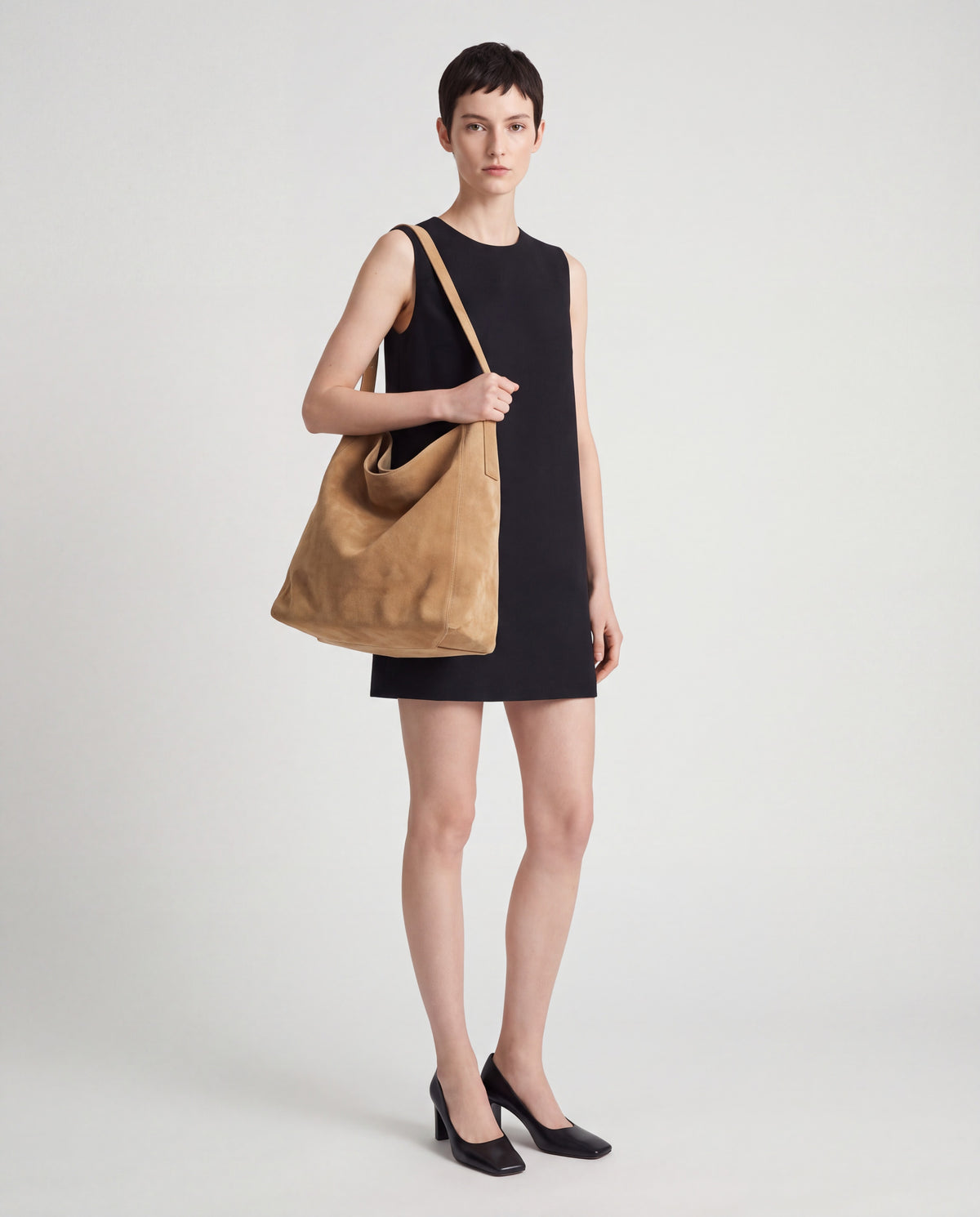 Fiato bag in Tan – worn by model, full length