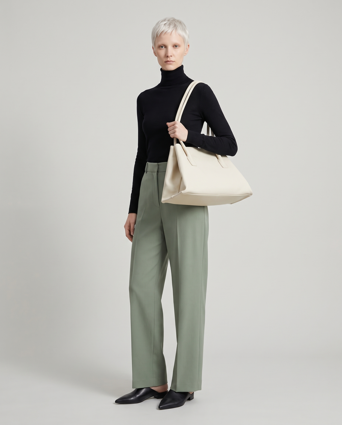 Model with the Gaia leather tote in ivory, full length