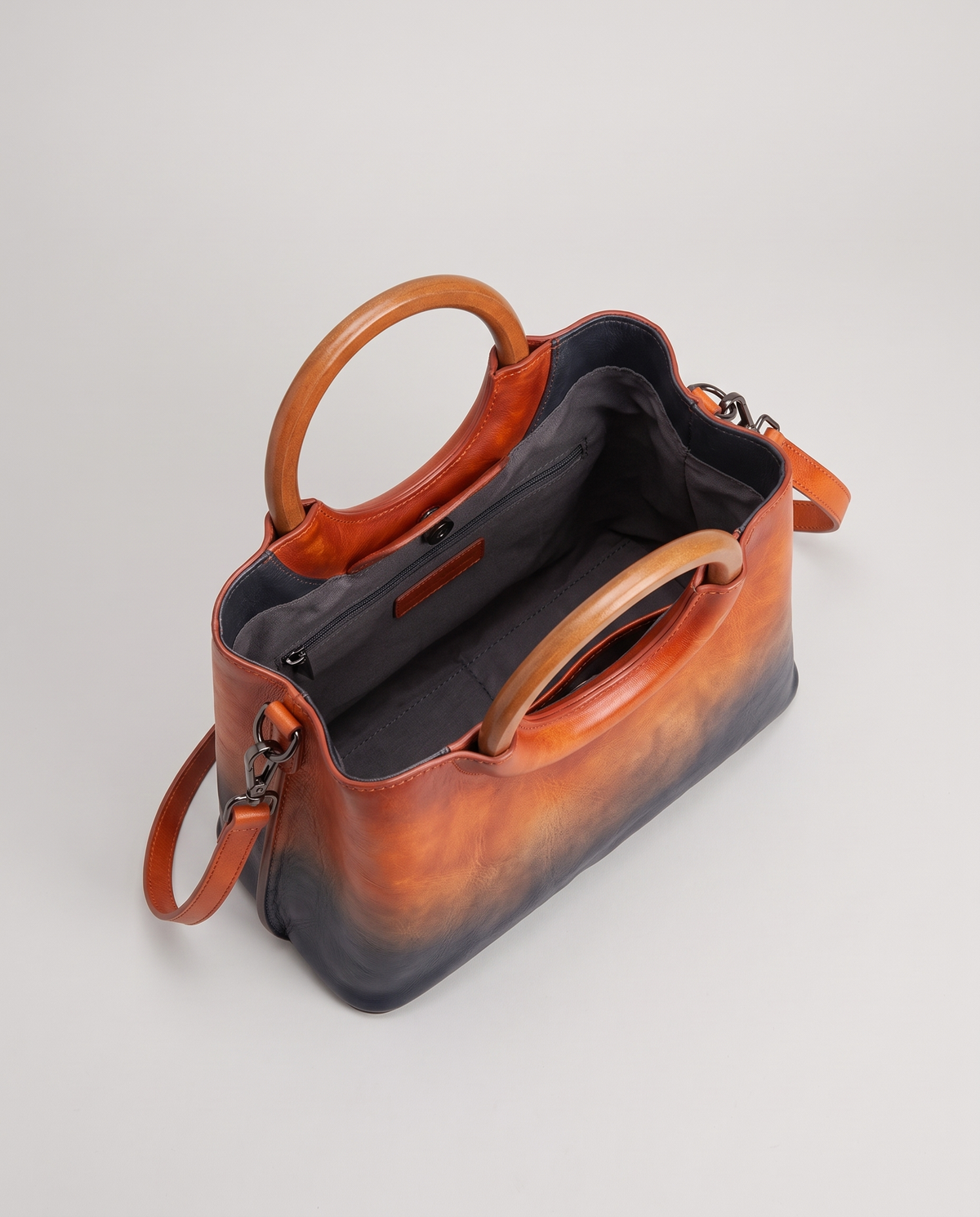 Ombra hand-painted ombré leather bag in Orange – view from above into the lined interior