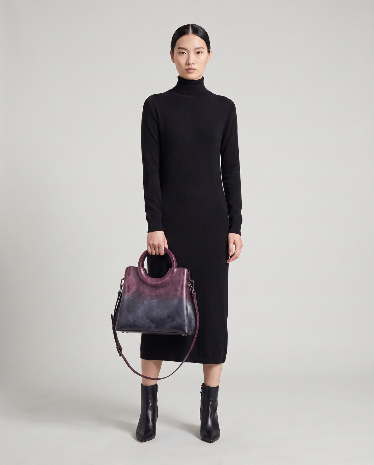 Ombra hand-painted ombré leather bag in Purple – model holding it by the ring handles, full length