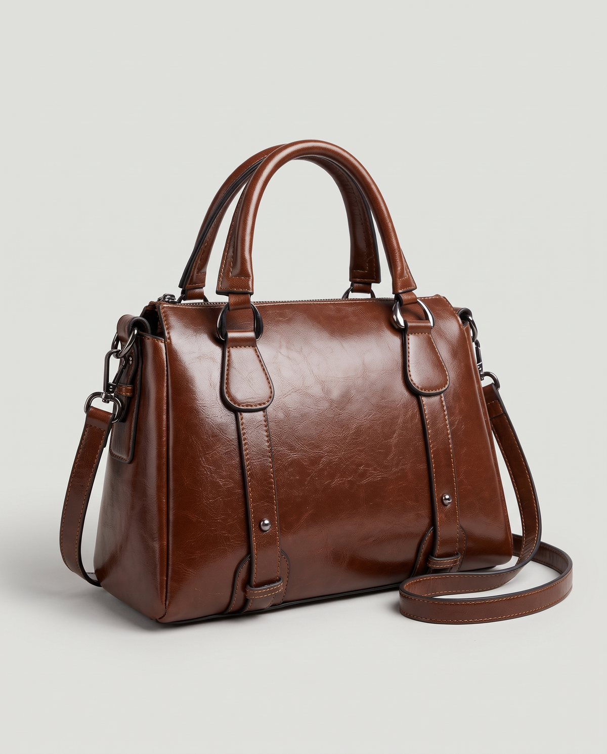 Harlow leather handbag in Coffee – three-quarter view with the shoulder strap attached